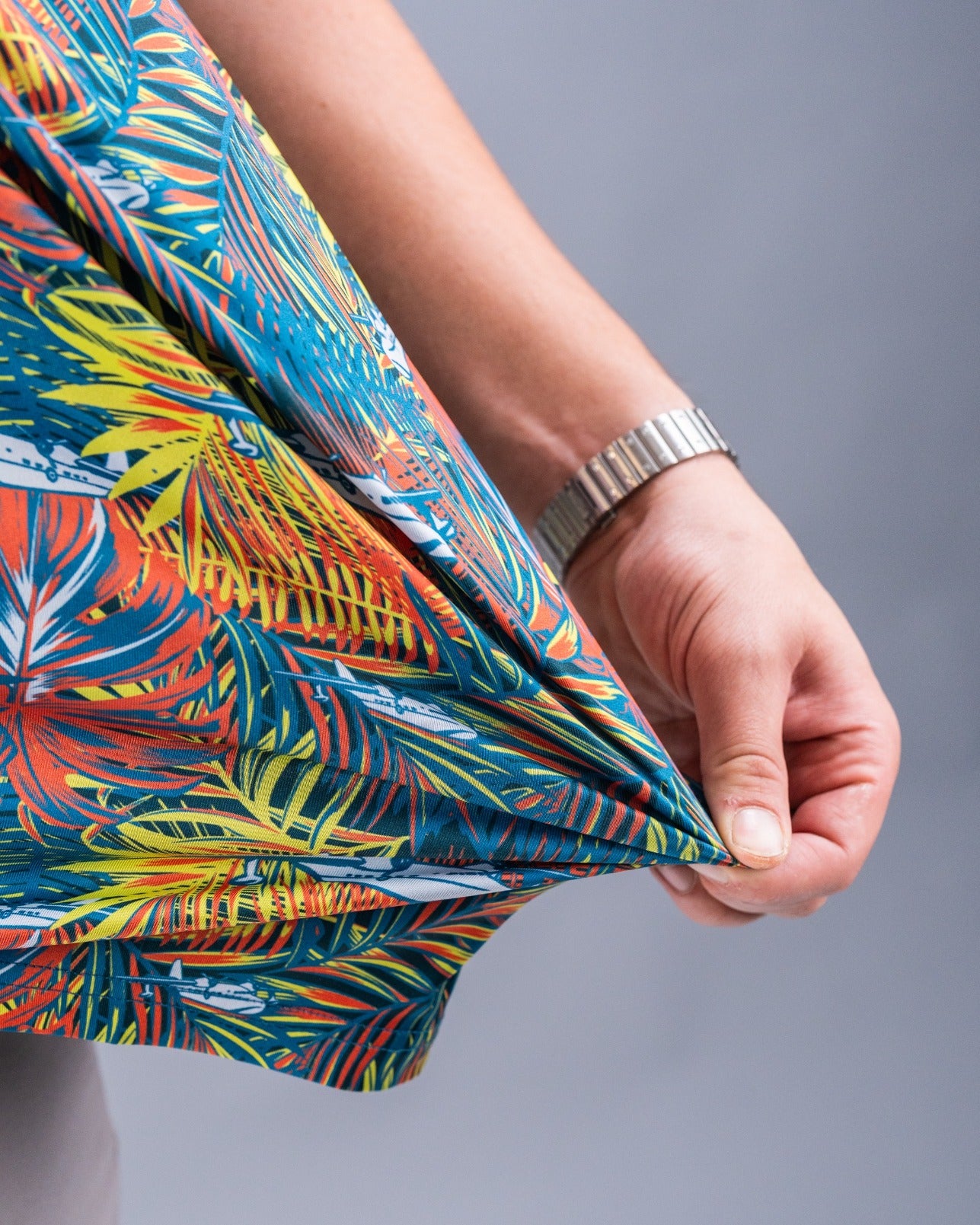 Colorful Margaritaville Bama Breeze shirt featuring vibrant tropical patterns, perfect for stylish golf outings.