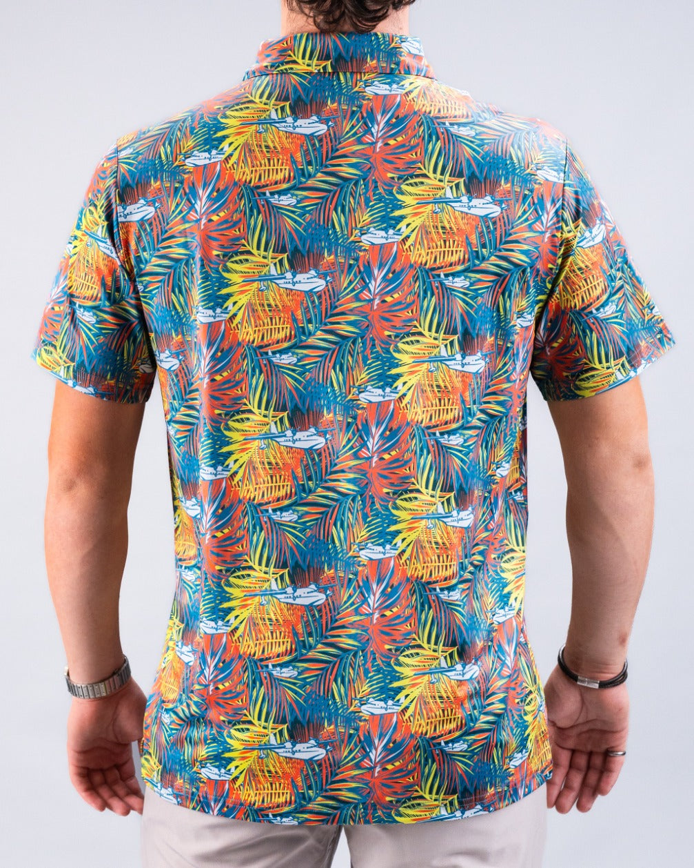 Men's Margaritaville Bama Breeze shirt featuring a vibrant tropical print with colorful palm leaves and drink motifs.