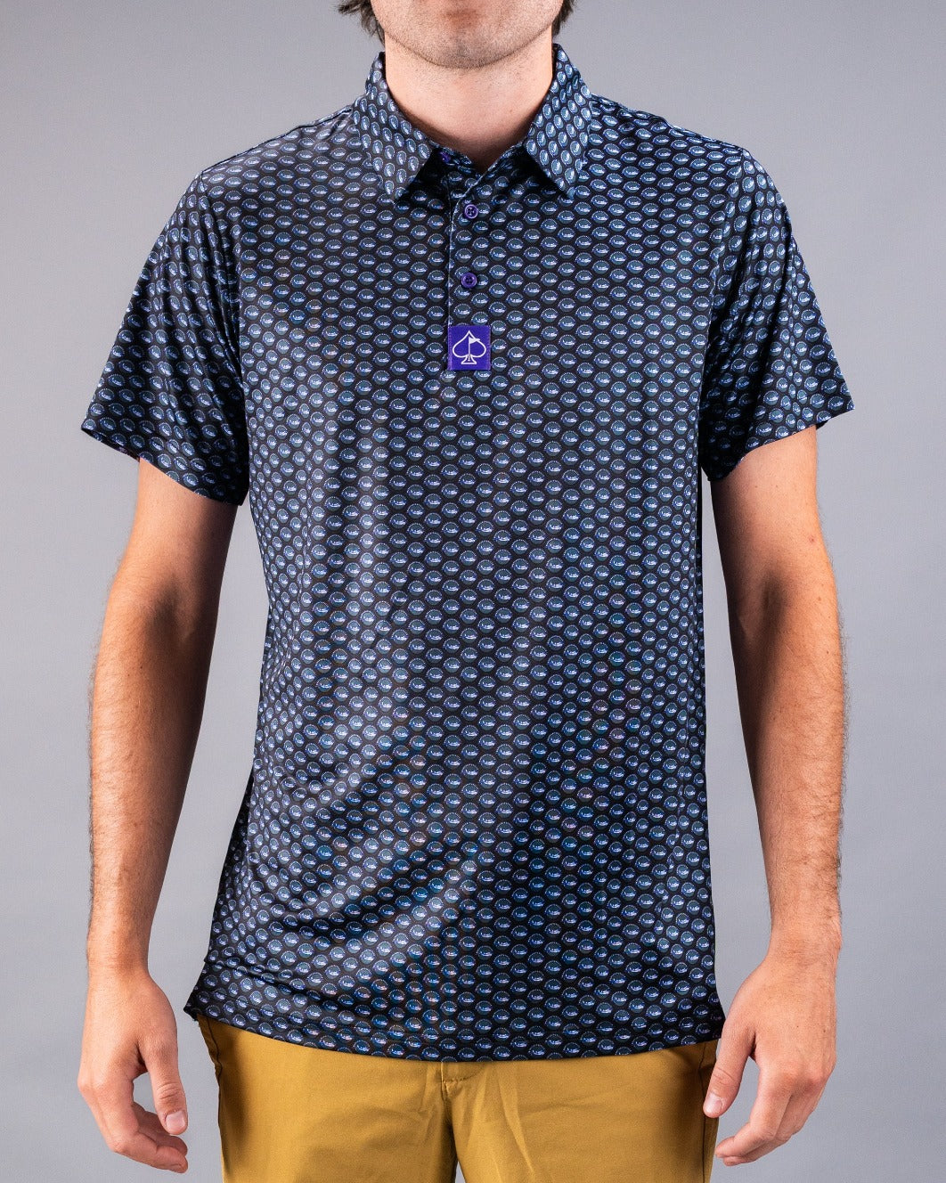 Men's Margaritaville Hemisphere Dancer polo shirt featuring a vibrant circular pattern, perfect for stylish golf outings.