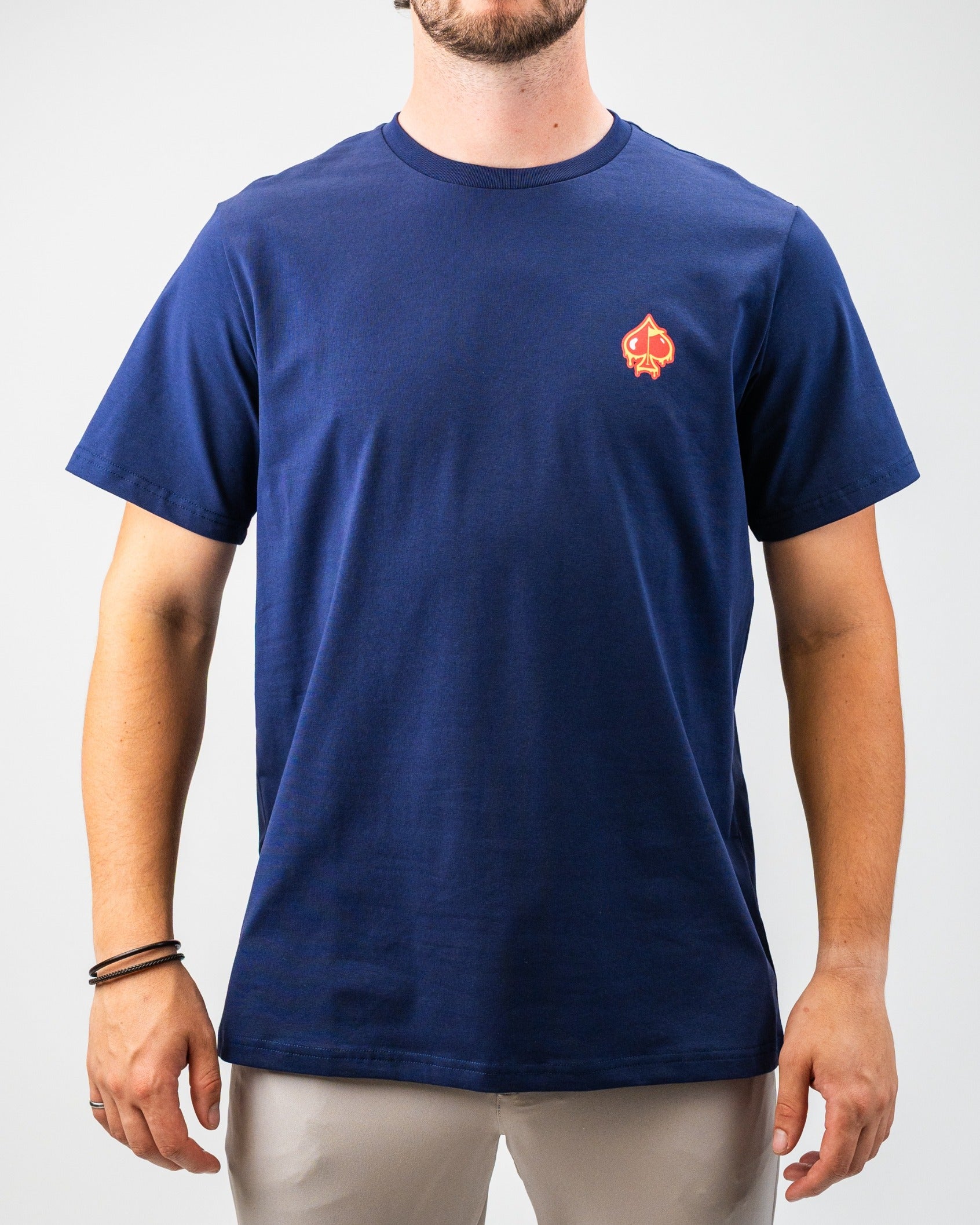Navy blue t-shirt featuring a small red Louisiana Hot Sauce logo with dancing peppers on the chest.