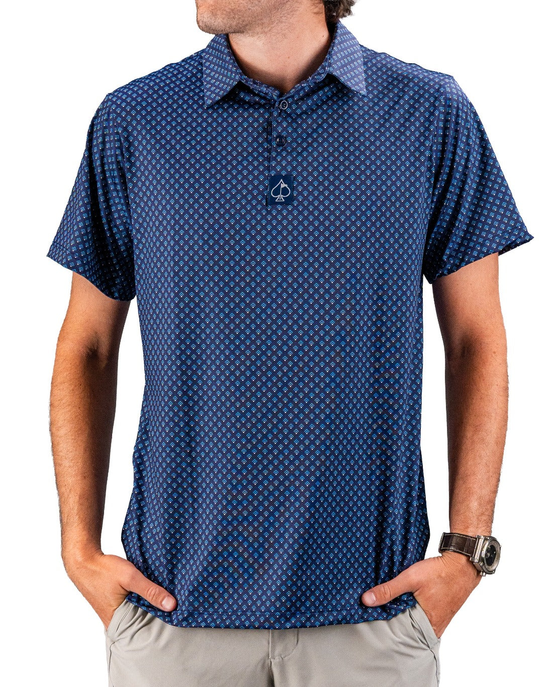 Blue patterned golf polo with a spade logo, short sleeves, and vibrant geometric print for bold style on the course.