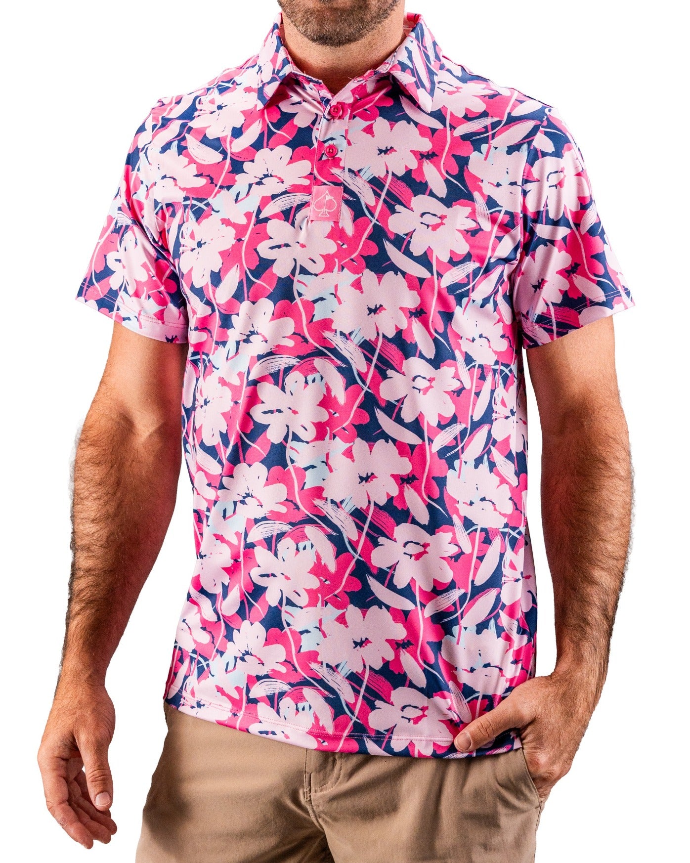 Men's pink, navy, and white floral golf polo shirt with a vibrant, bold pattern for standout style on the course.