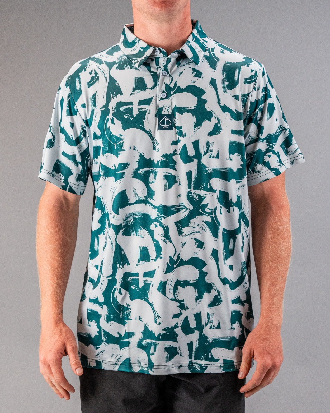 Men's golf polo shirt featuring a bold green and white paint stroke pattern, designed for a stylish and unique look on the course.