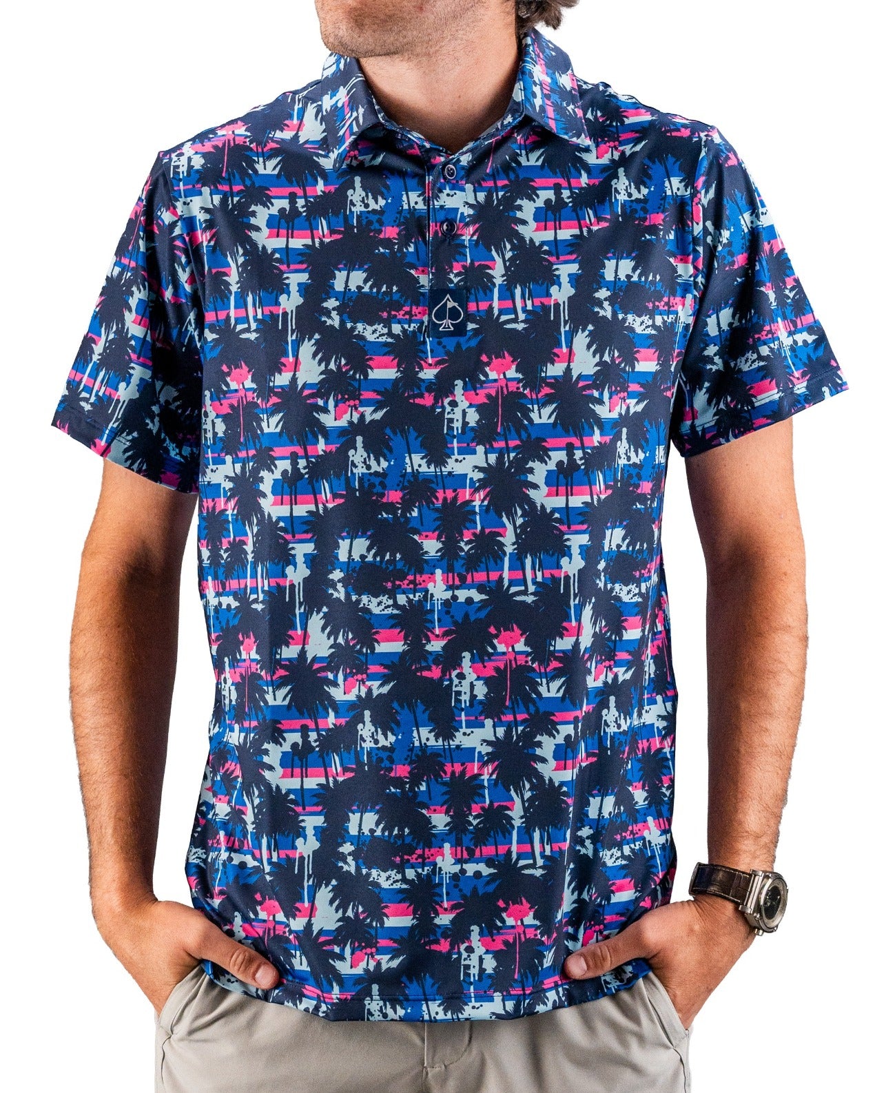 Bright tropical-patterned golf shirt with navy, pink, and blue palm trees, perfect for bold golf style on the course.