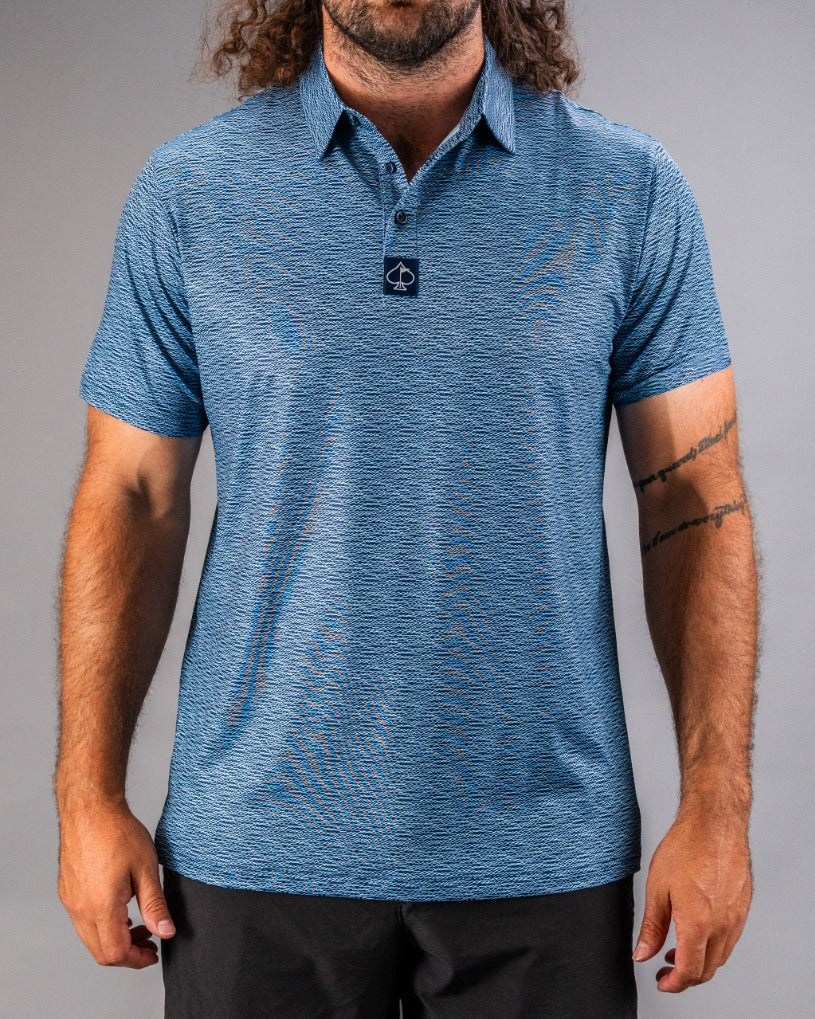 Men's short-sleeve golf polo in blue with a textured squiggle pattern and a logo on the collar, ideal for stylish play.