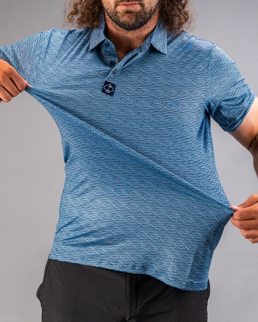 Men's blue golf polo shirt with a textured squiggle pattern, designed for comfort and style on the course.