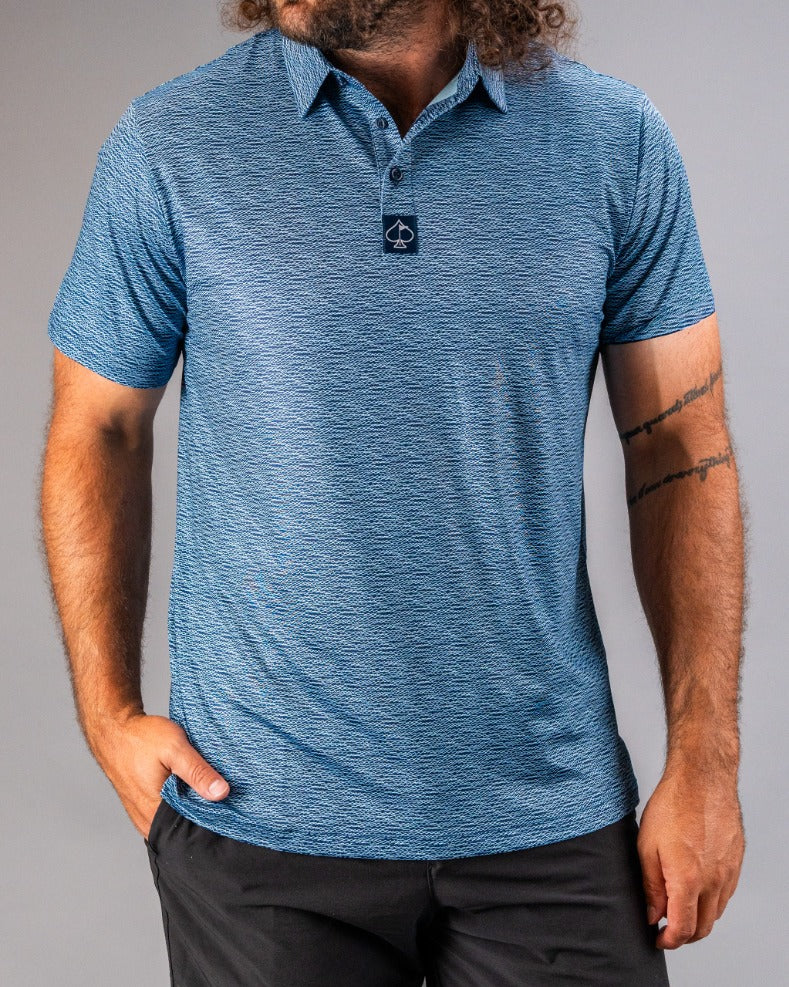 Men's blue polo shirt featuring a textured squiggle pattern, designed for stylish comfort on the golf course.