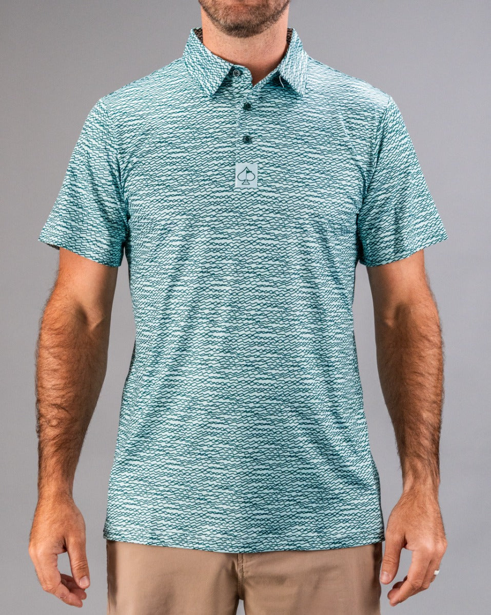 Teal golf polo shirt featuring a squiggle pattern, designed for style and comfort on the course.