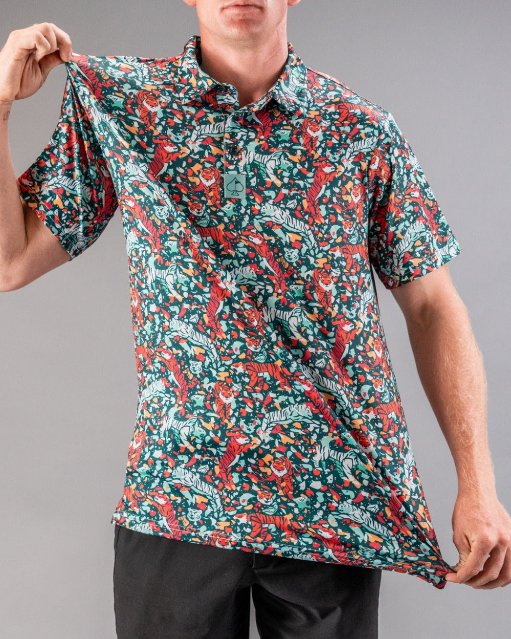Bold teal golf shirt featuring a vibrant tiger and floral pattern, perfect for golfers looking to make a statement on the course.