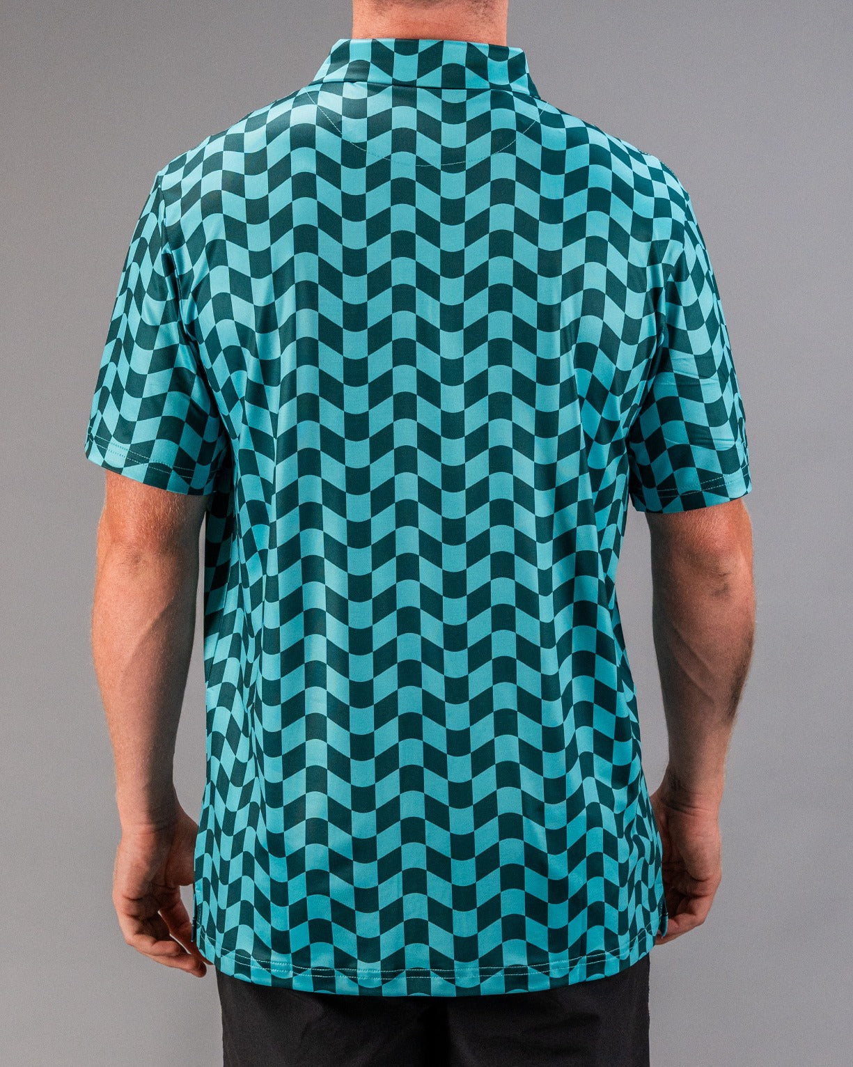 Men's golf shirt featuring a bold wavy checkered pattern in teal and black, designed for stylish performance on the course.