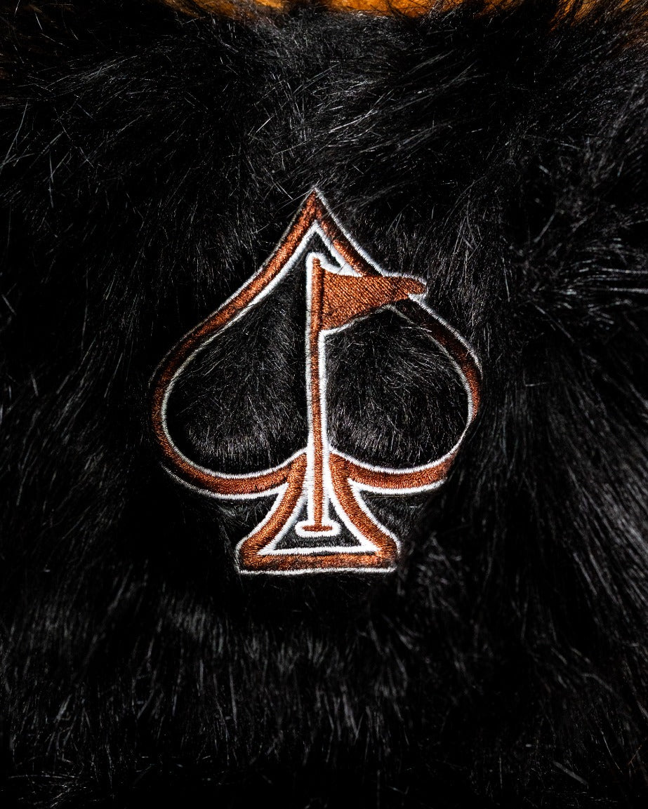 Woolly Mammoth driver cover featuring a plush black fur design and a stylish spade logo with a flag detail.