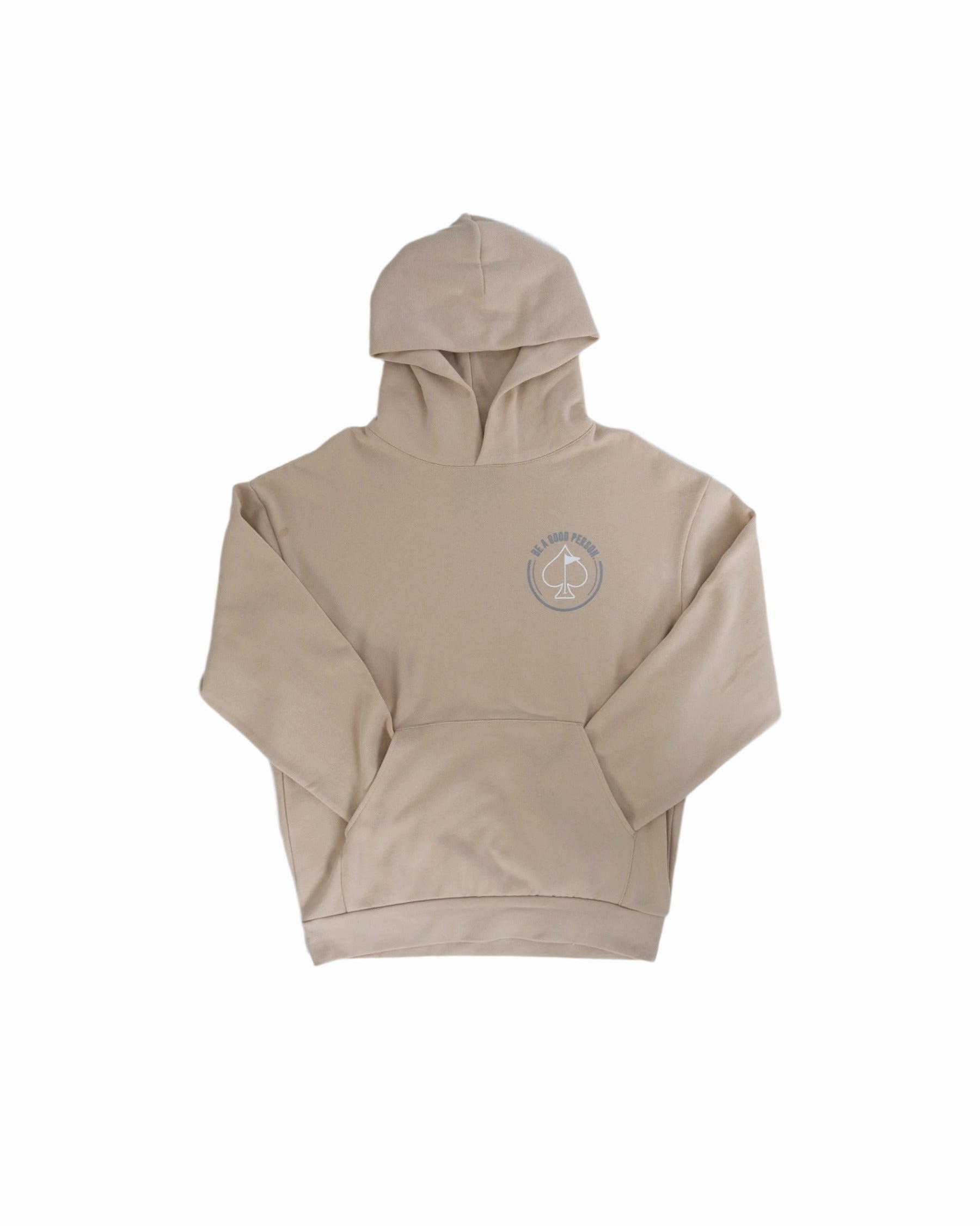 Cream hoodie featuring a front pocket and a "Be A Good Person" graphic, perfect for stylish comfort on and off the golf course.
