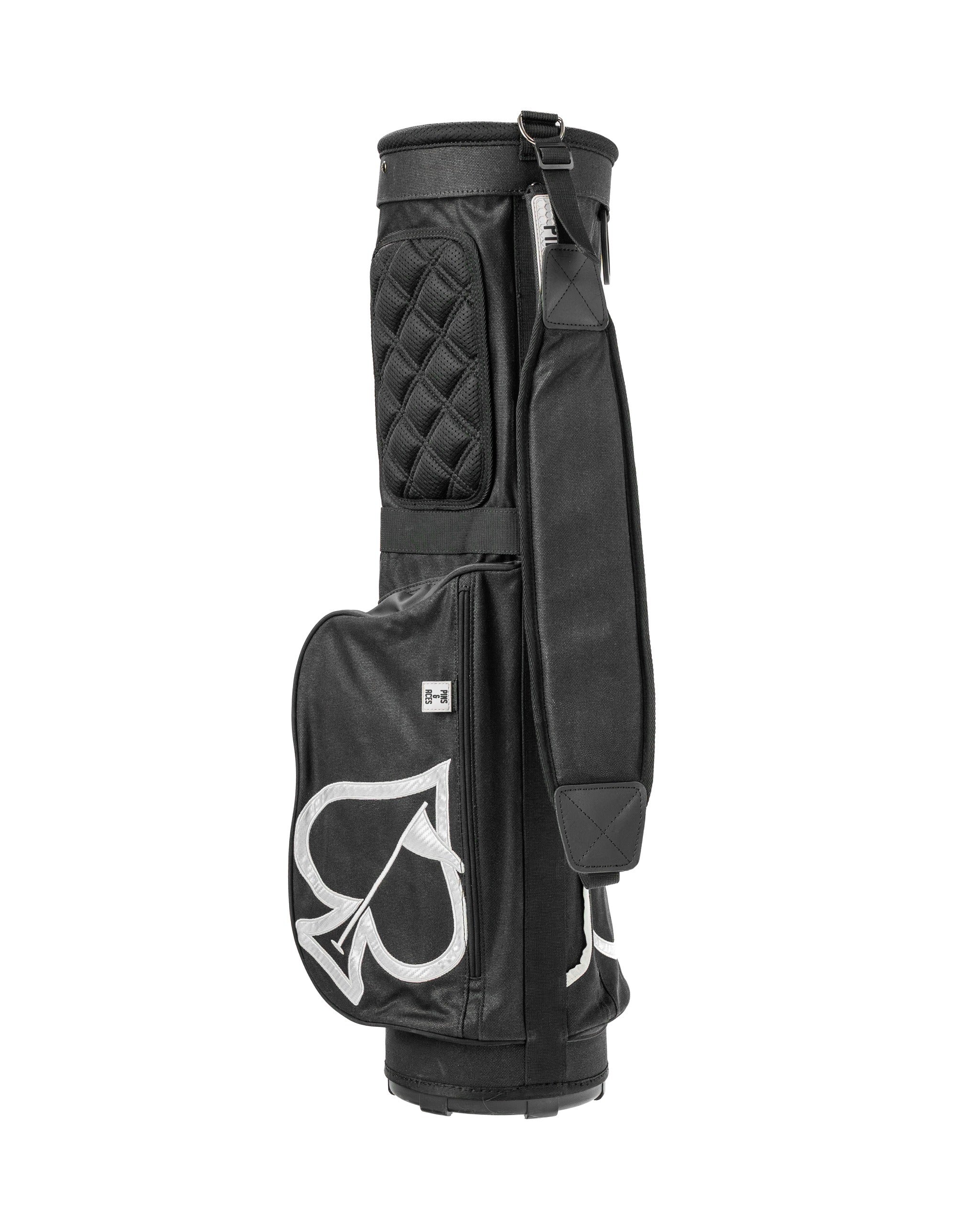 Sleek black Sunday golf bag featuring a quilted design and a prominent spade logo, ideal for stylish golfers on the go.