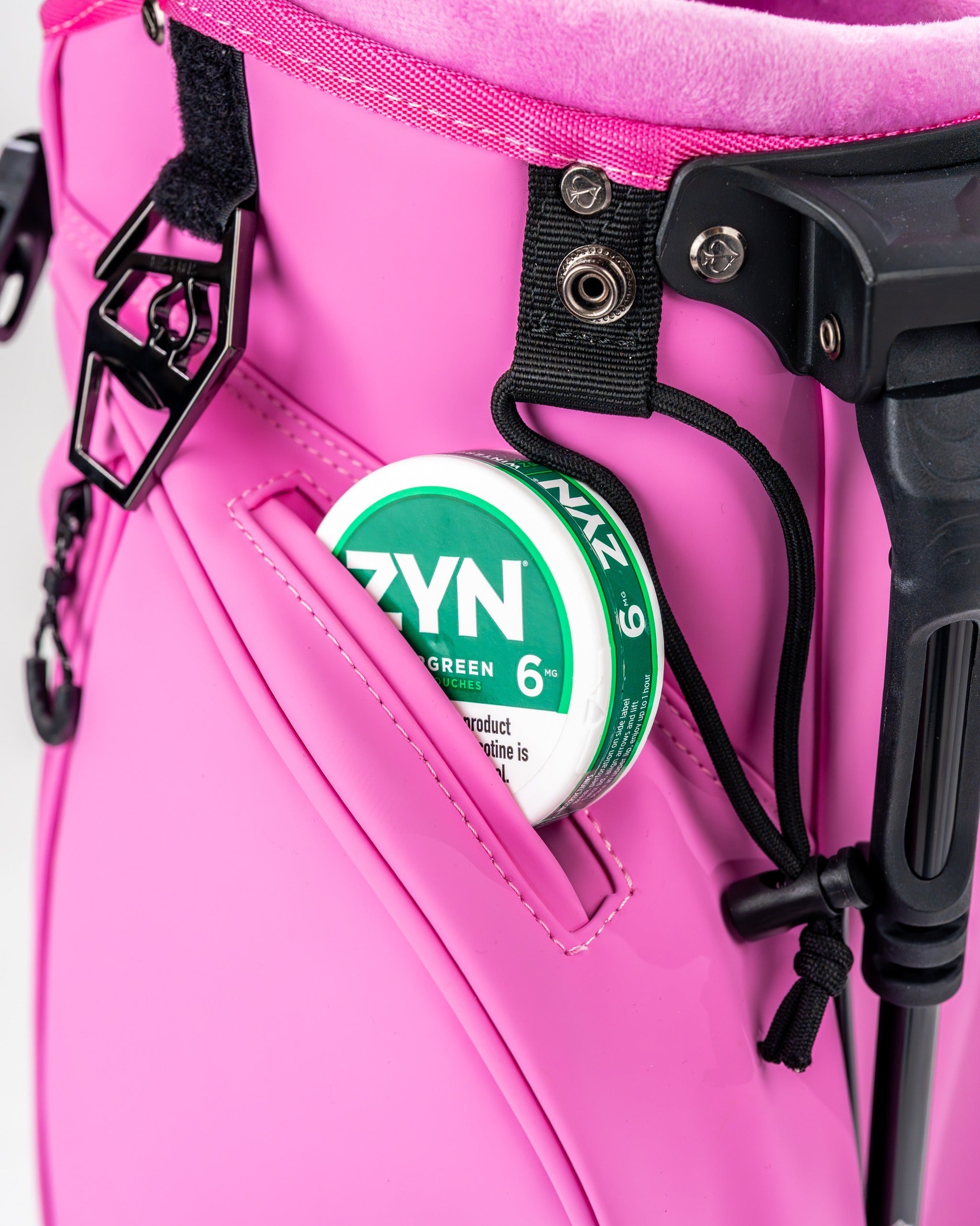 Close-up of the Player Preferred Golf Bag in Bubblegum 2.0, featuring a pocket with a can of ZYN nicotine pouch.