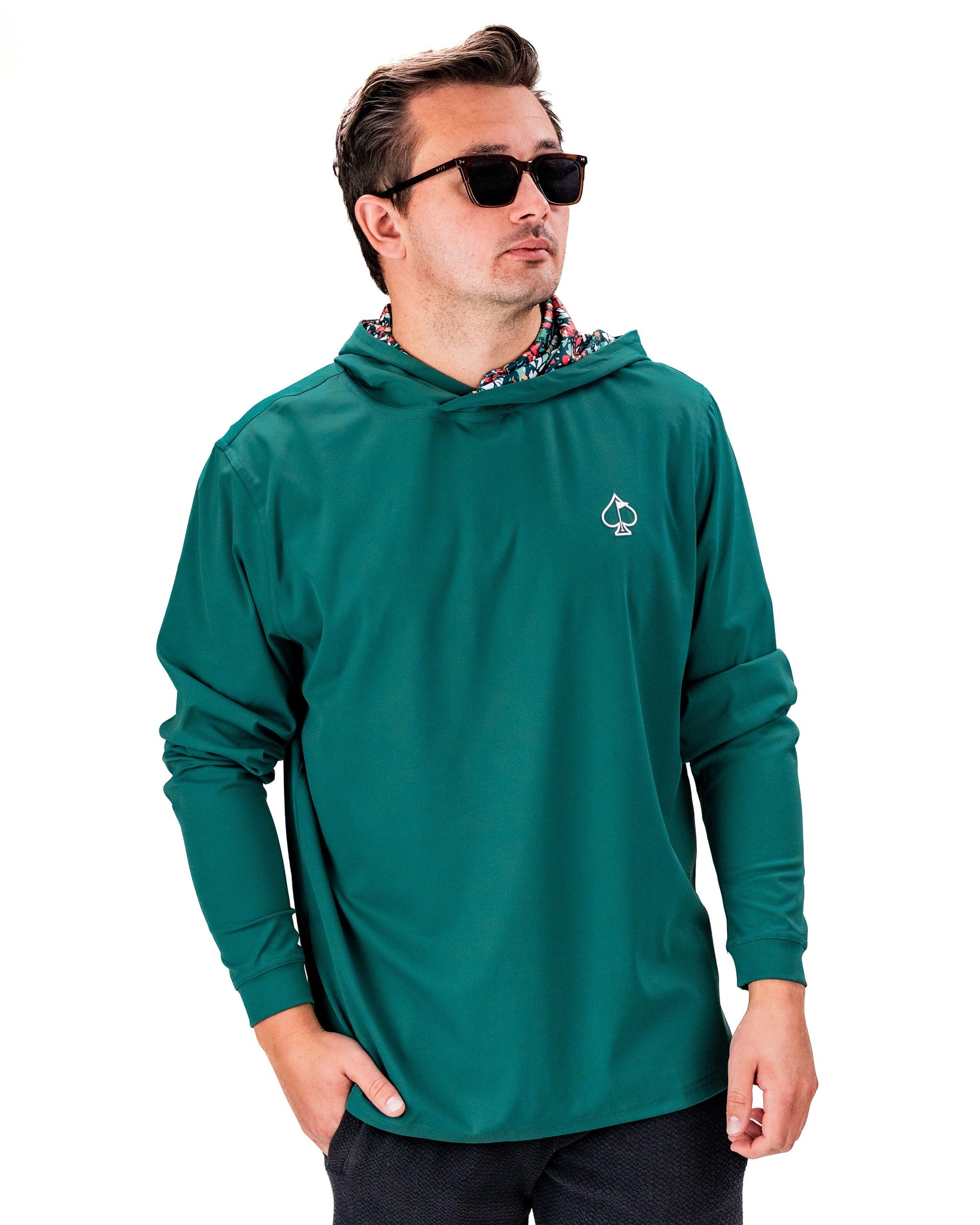 Men's performance golf hoodie in teal with a stylish hood design, perfect for golfers seeking comfort and style on the course.