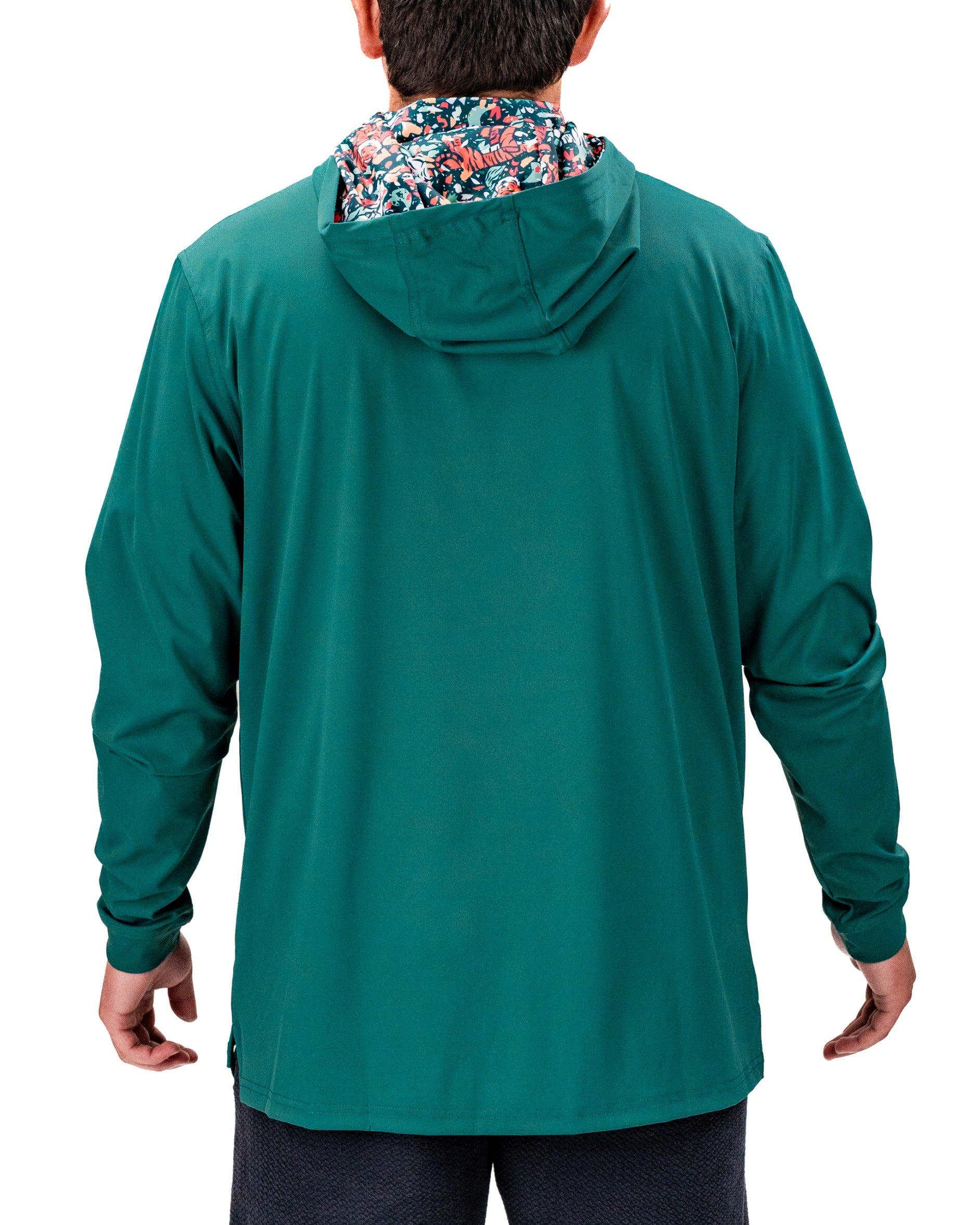 Men's performance golf hoodie in teal with a floral-patterned hood, designed for comfort and style on the course.