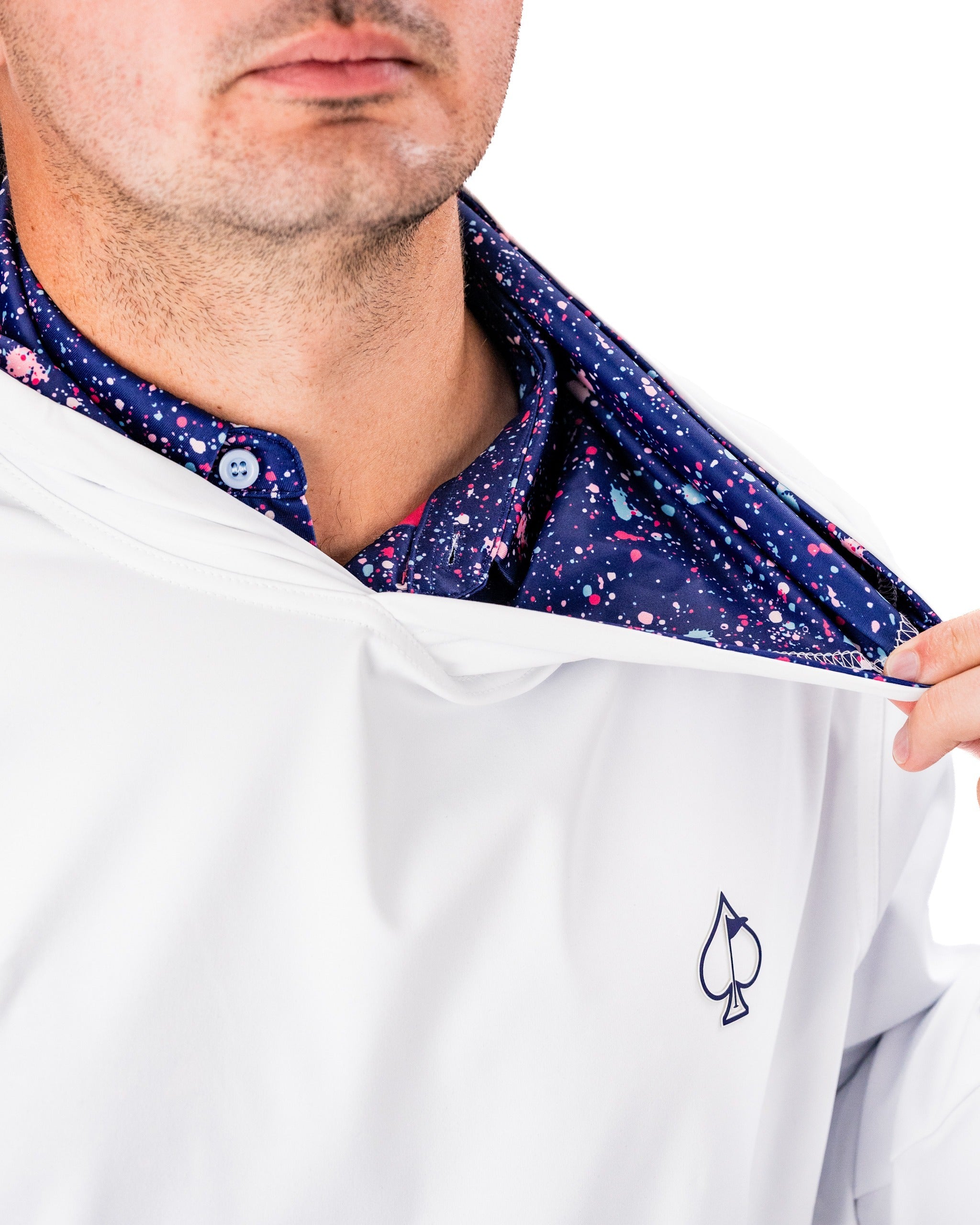 Performance golf hoodie in white featuring a blue splatter interior, designed for comfort and style on the course.