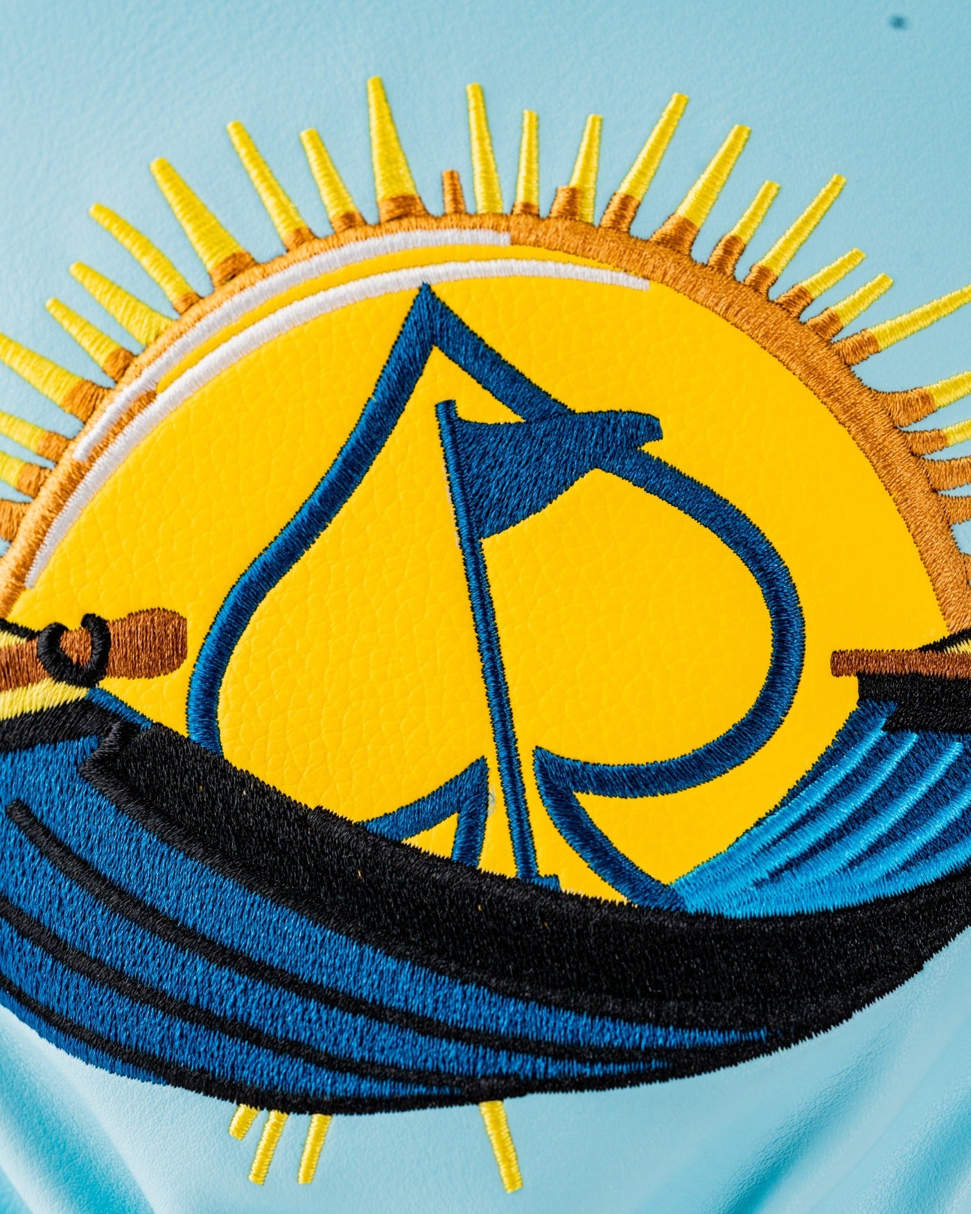 Vibrant Margaritaville Fins Up driver cover featuring a sun and spade design, perfect for stylish golf enthusiasts.