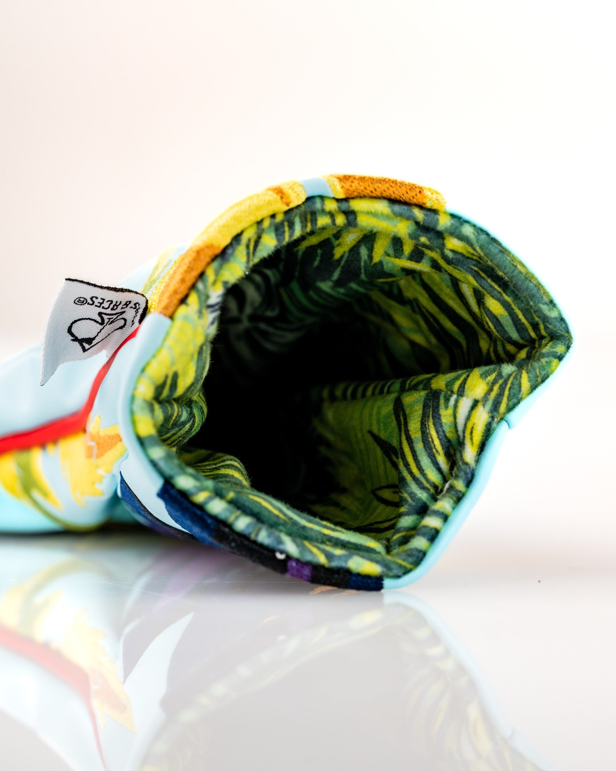 Colorful Margaritaville Polly hybrid headcover featuring a tropical design and a soft, patterned interior for protection.