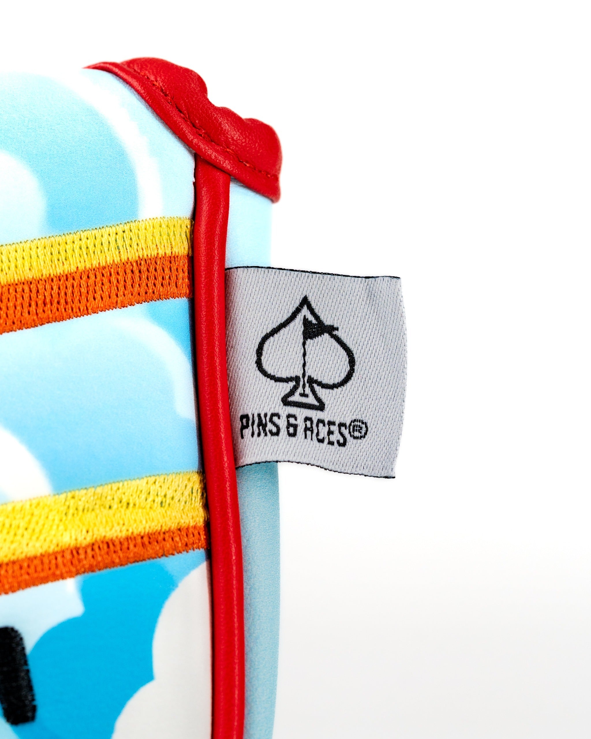 Margaritaville Puddle Jumper mallet putter cover featuring a vibrant cloud design and Pins & Aces logo.
