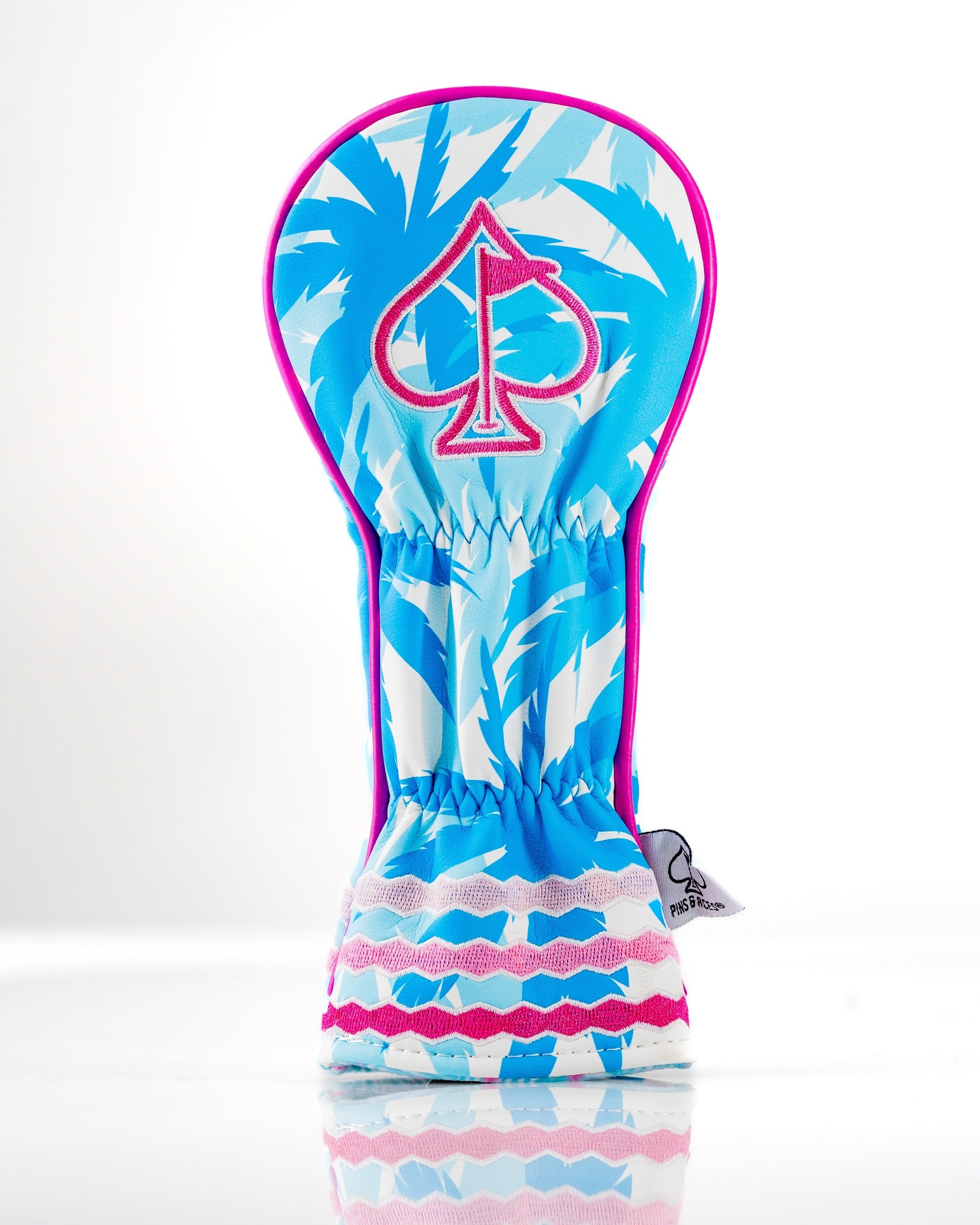 Bold flamingo-patterned hybrid golf cover featuring a pink spade logo, designed for stylish protection on the course.