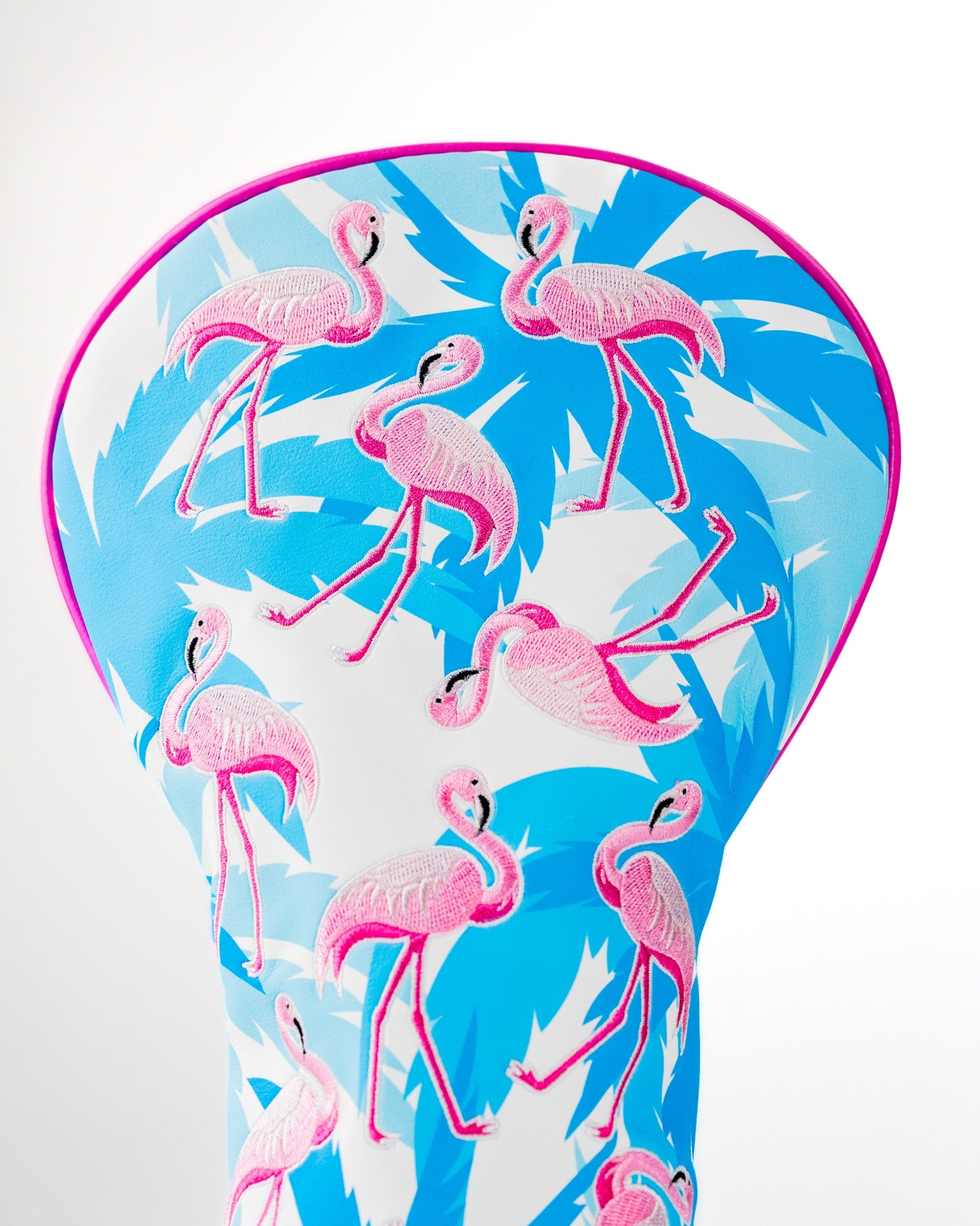 Colorful driver cover featuring a vibrant flamingo design on a blue tropical background, perfect for stylish golfers.