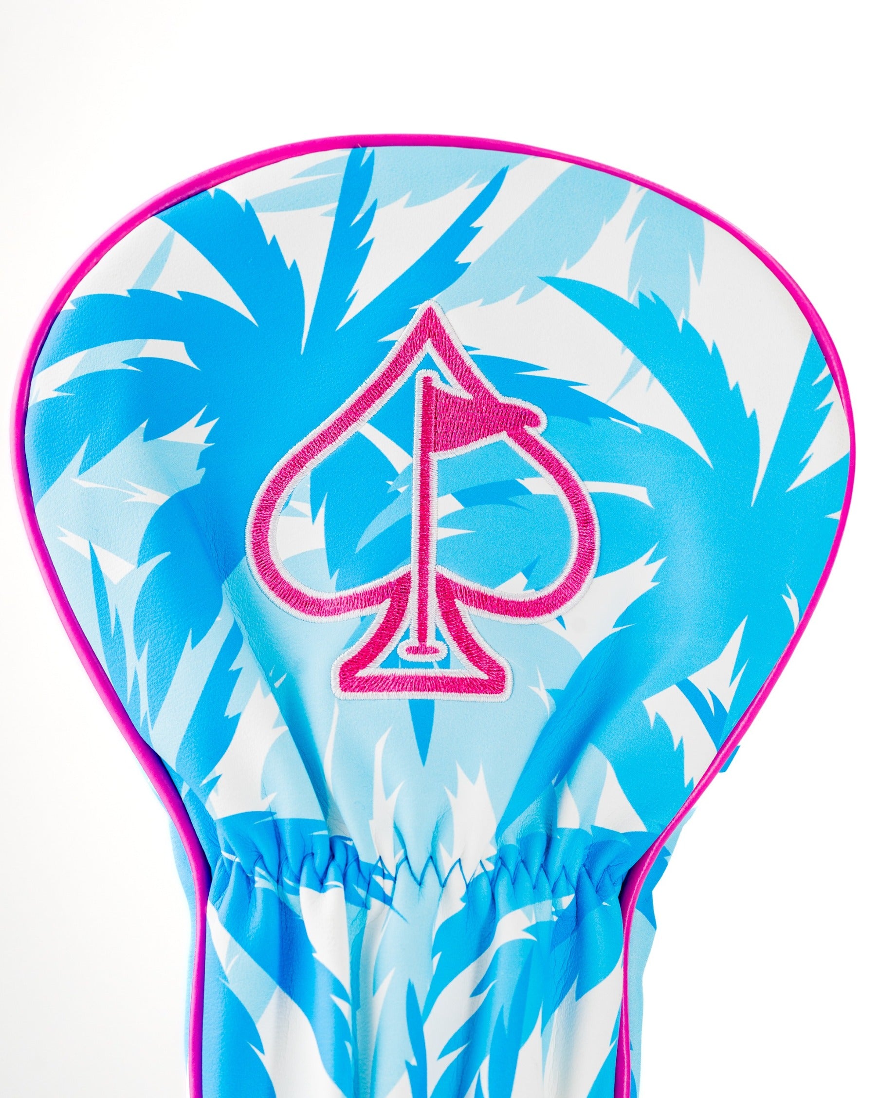 Bold flamingo-patterned driver cover featuring a vibrant blue and white design with a pink spade logo.
