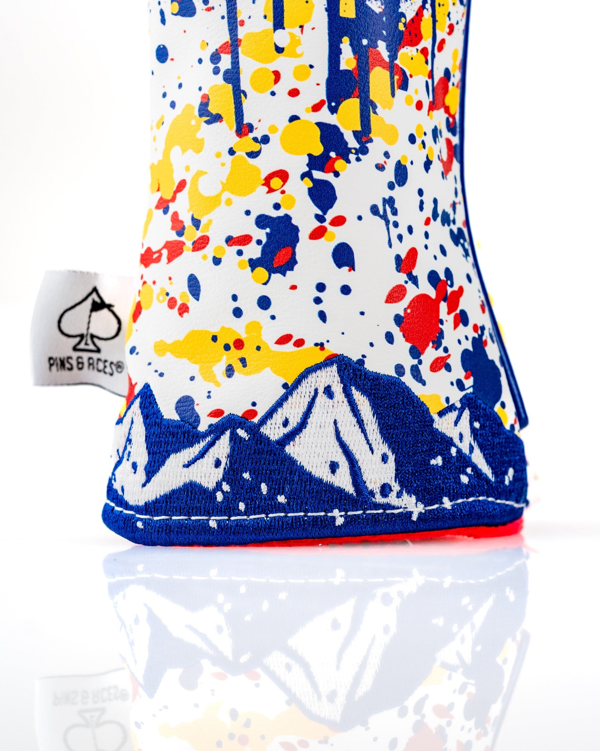 Colorful Colorado 2.0 hybrid cover featuring a mountain design and vibrant splatter pattern, perfect for stylish golfers.