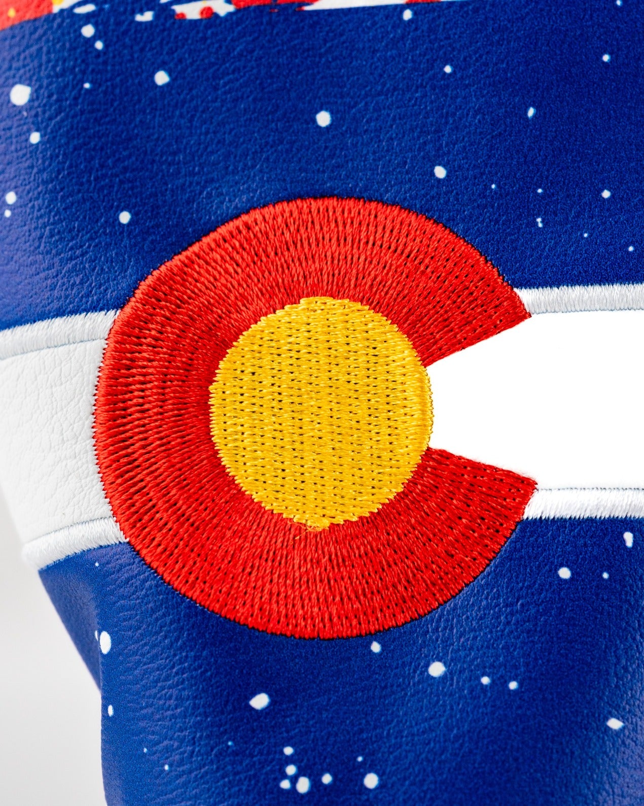 Bold Colorado-themed hybrid golf cover featuring vibrant colors and an embroidered state emblem for standout style on the course.