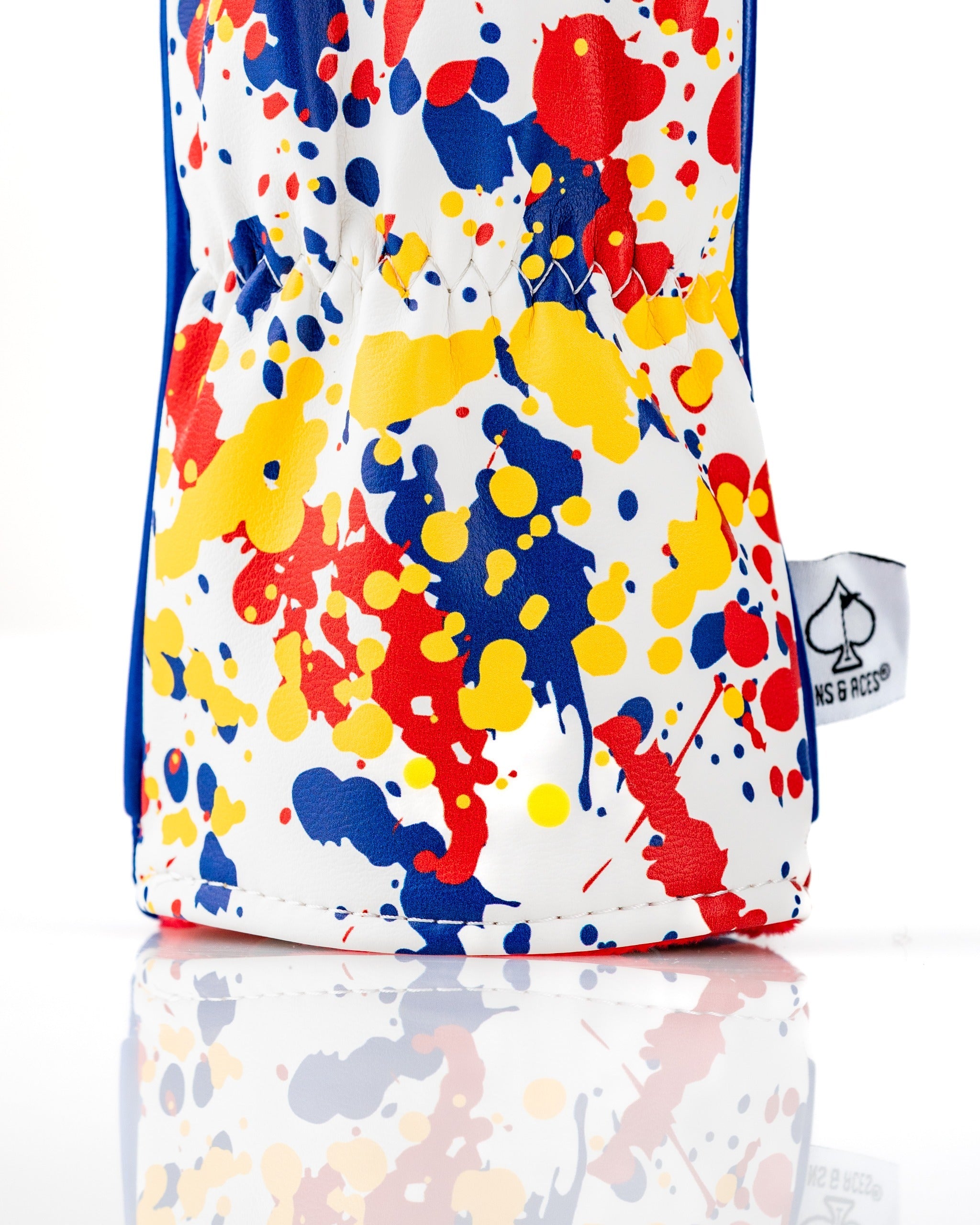 Bold Colorado 2.0 fairway cover featuring a vibrant splatter design in red, yellow, and blue colors for stylish protection.