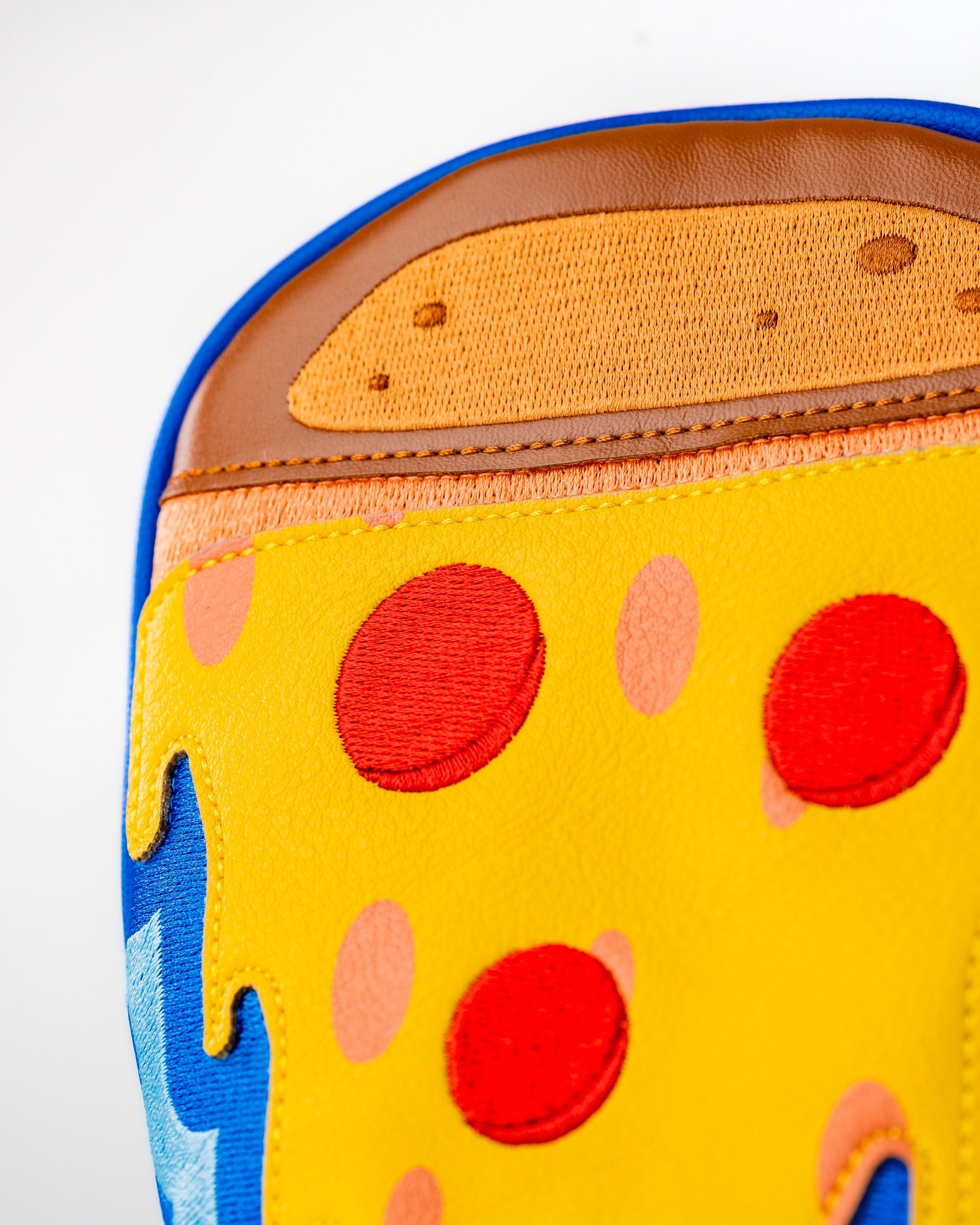 Colorful pizza-themed fairway cover featuring vibrant cheese, pepperoni, and a playful design for golf clubs.