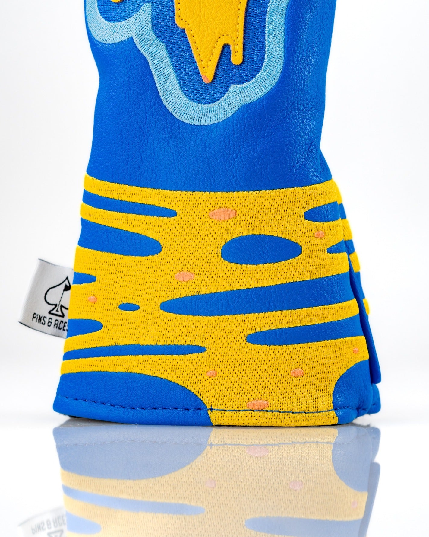Bold pizza-themed fairway cover featuring vibrant blue and yellow colors, designed for golfers to stand out on the course.