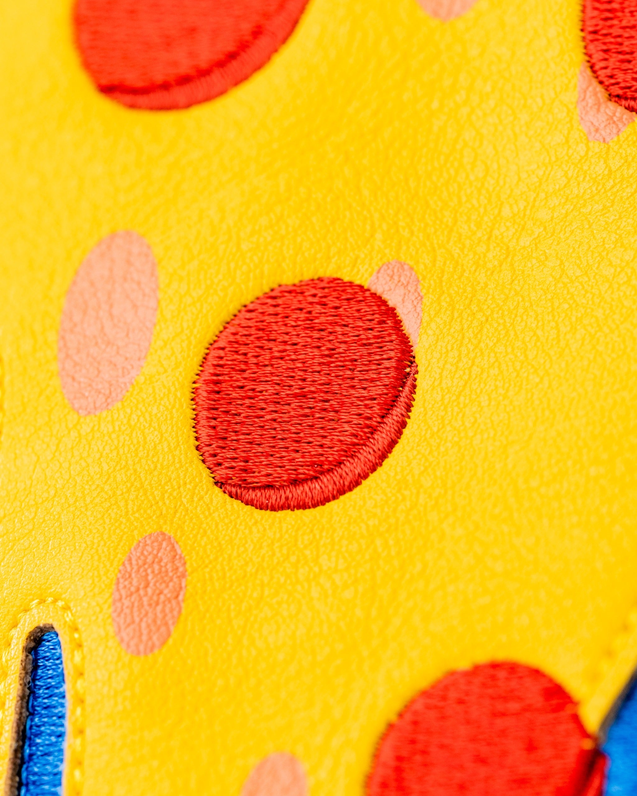 Bright yellow fairway cover featuring playful red and pink polka dots, designed for a fun and unique golf experience.