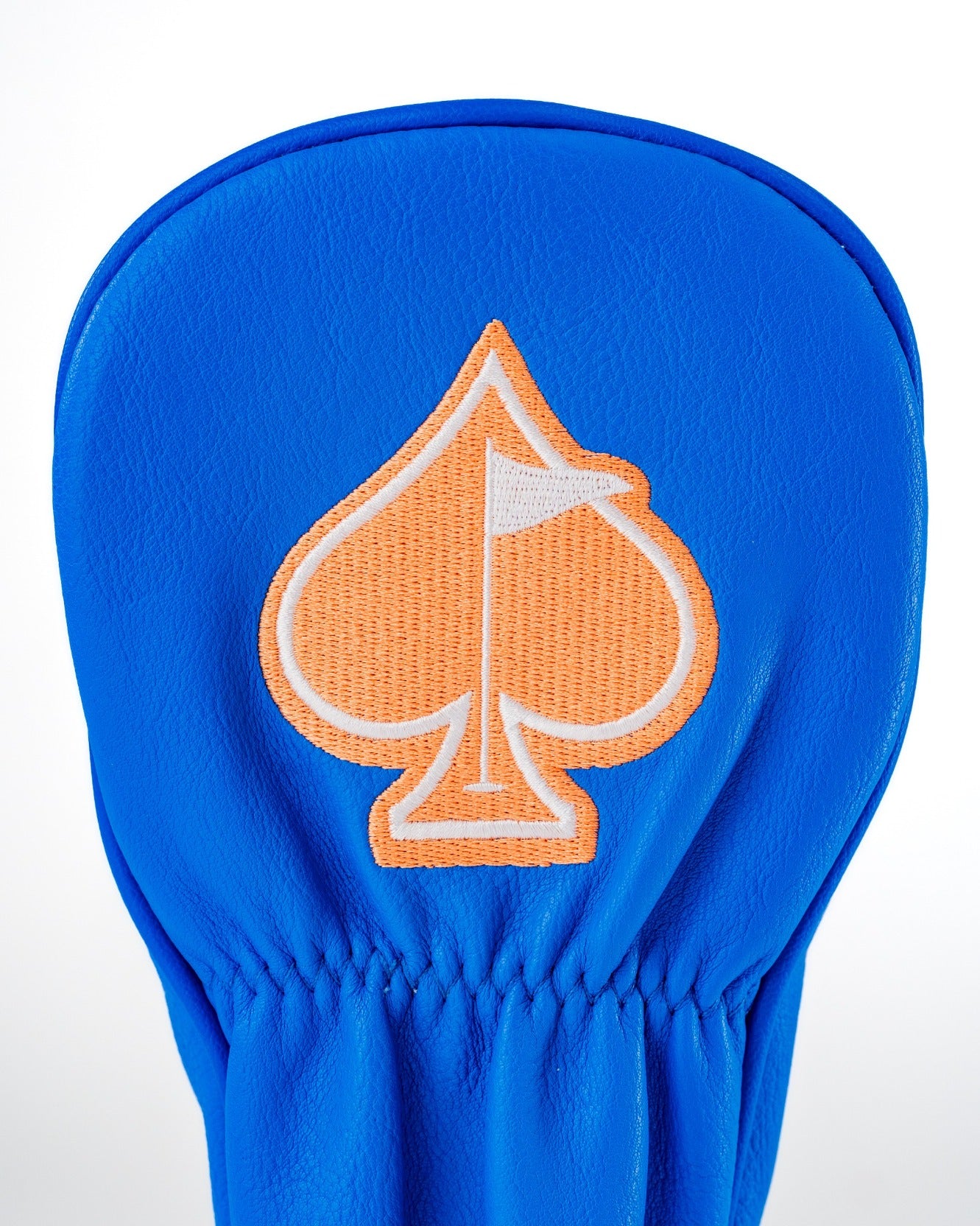 Bright blue golf fairway cover featuring an orange spade logo with a golf flag, designed for stylish protection on the course.