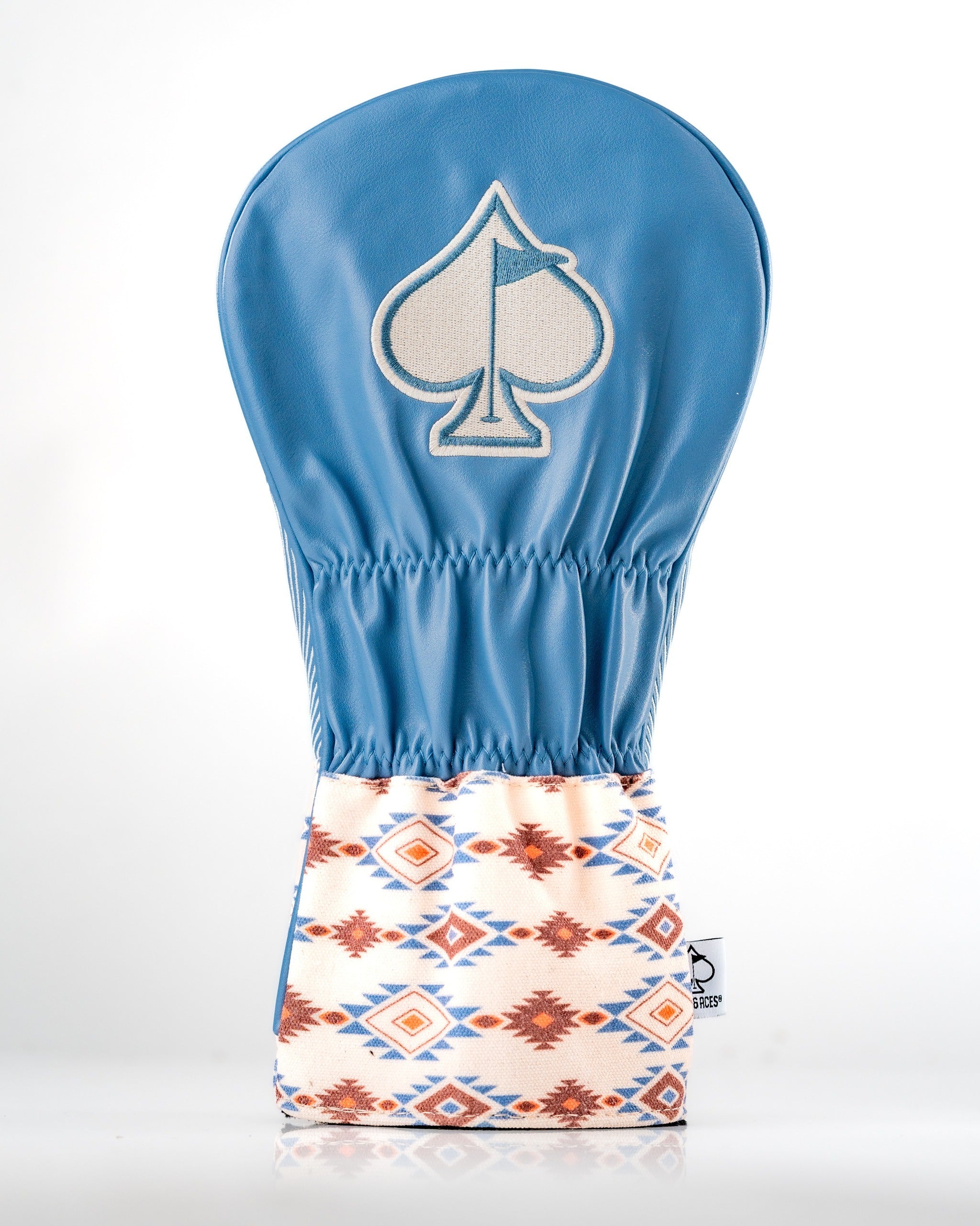 Western aesthetic driver cover featuring a blue leather top with a spade logo and a patterned fabric bottom.