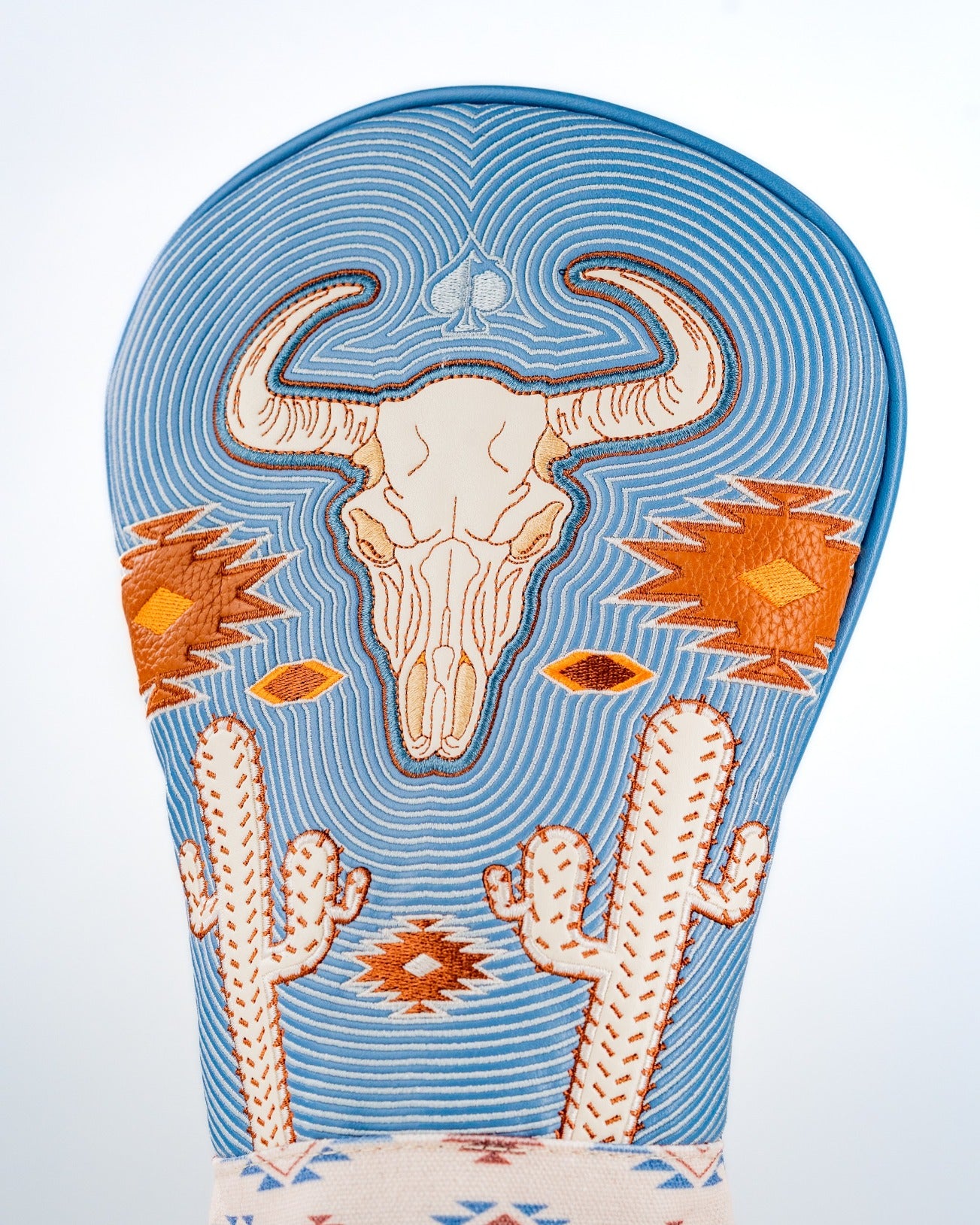 Western aesthetic driver cover featuring a detailed skull design, cacti, and vibrant geometric patterns. Perfect for stylish golfers.