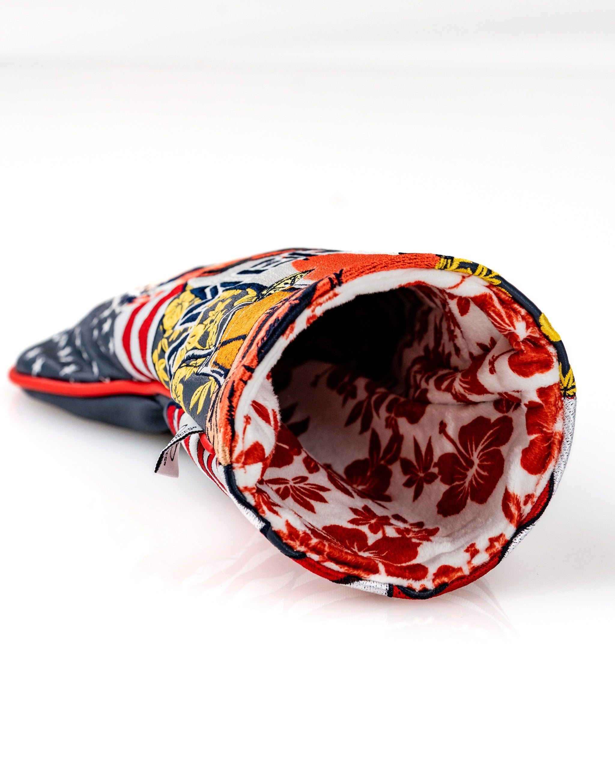 Colorful driver cover featuring floral patterns and a patriotic design, perfect for golfers seeking a bold accessory.