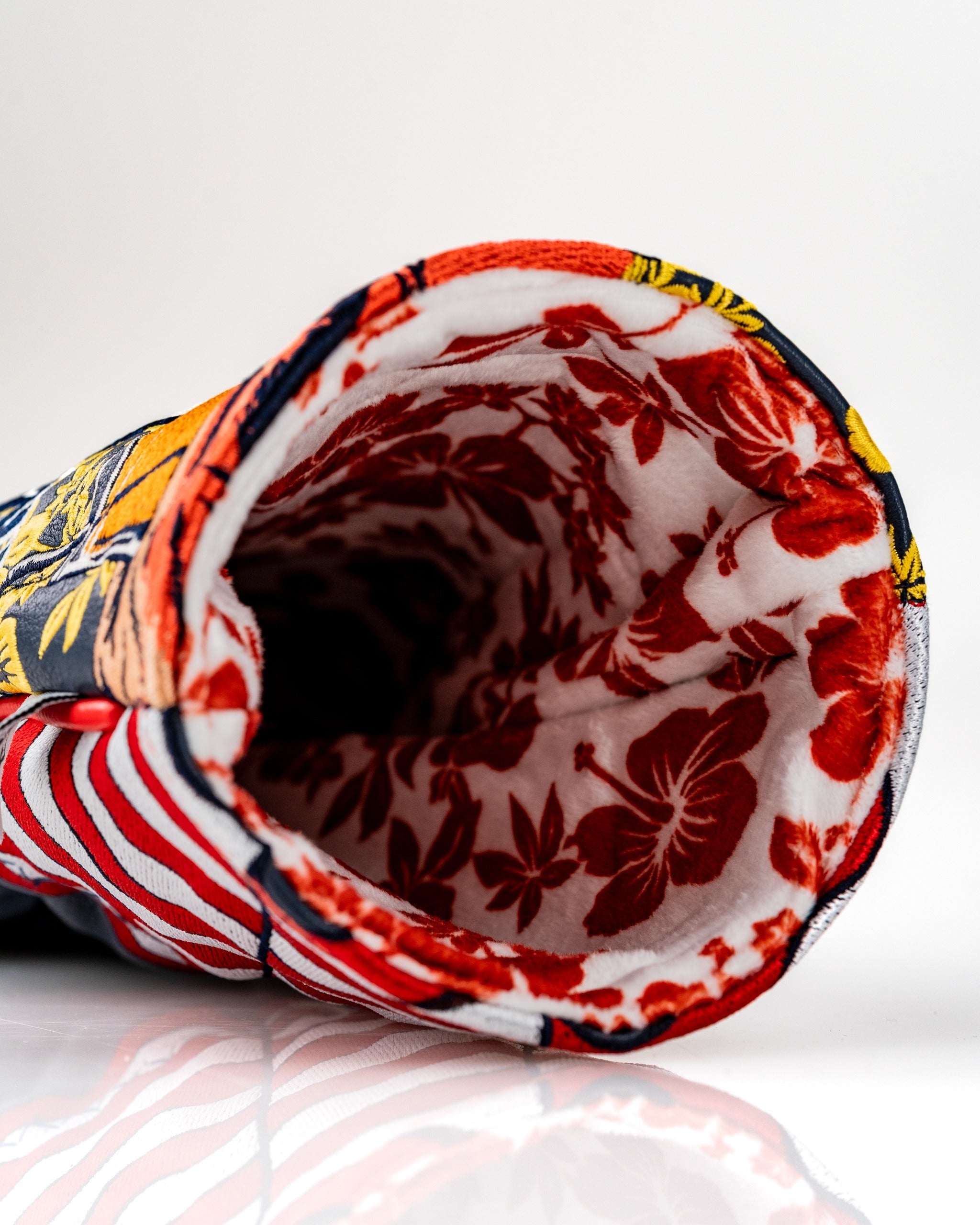 Interior view of the Trump Gulf of America driver cover, featuring vibrant floral patterns and a soft lining for protection.
