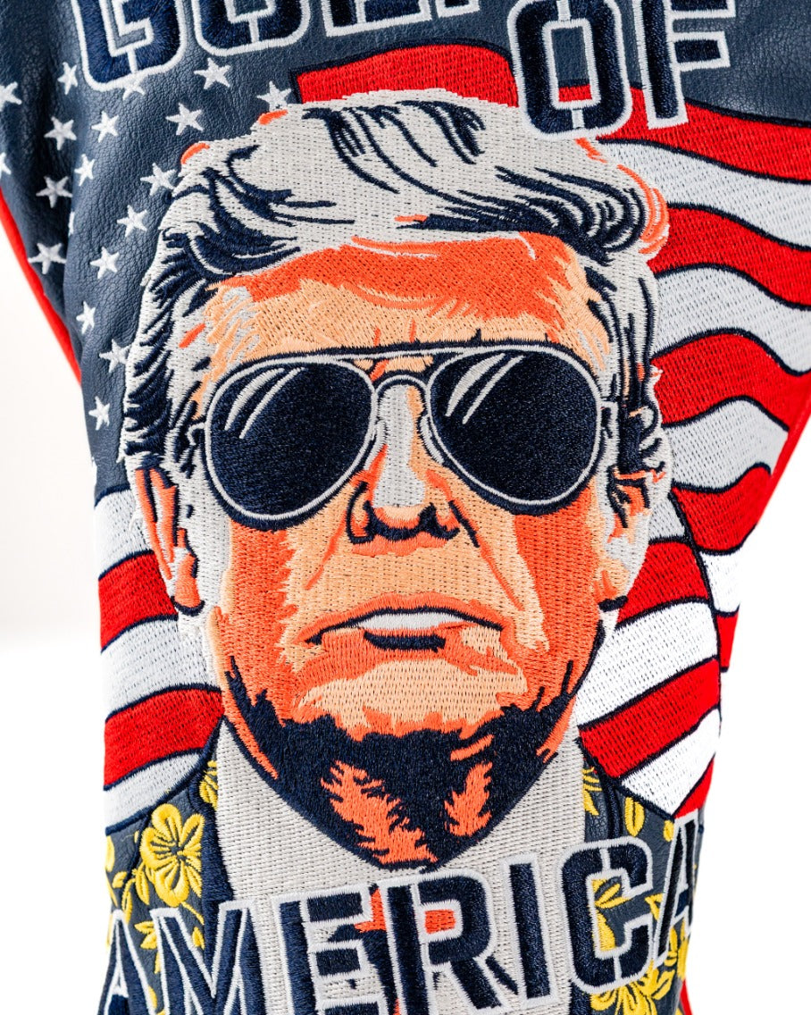 Bold driver cover featuring a stylized portrait of a man in sunglasses against a backdrop of American flags.