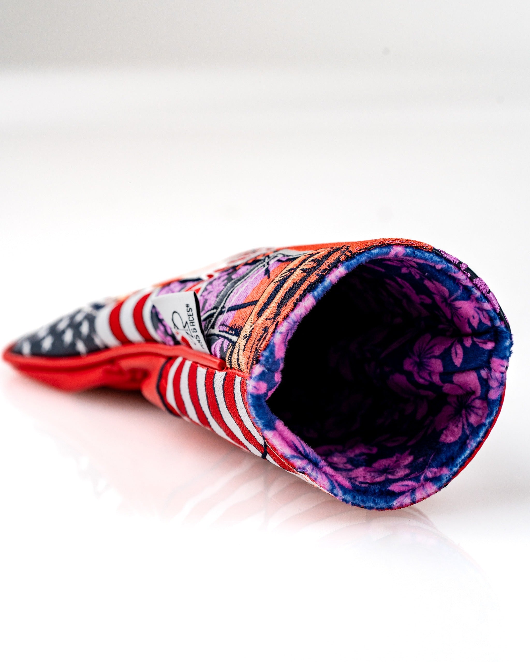Bold fairway cover featuring a vibrant design with patriotic colors and floral patterns, perfect for stylish golfers.