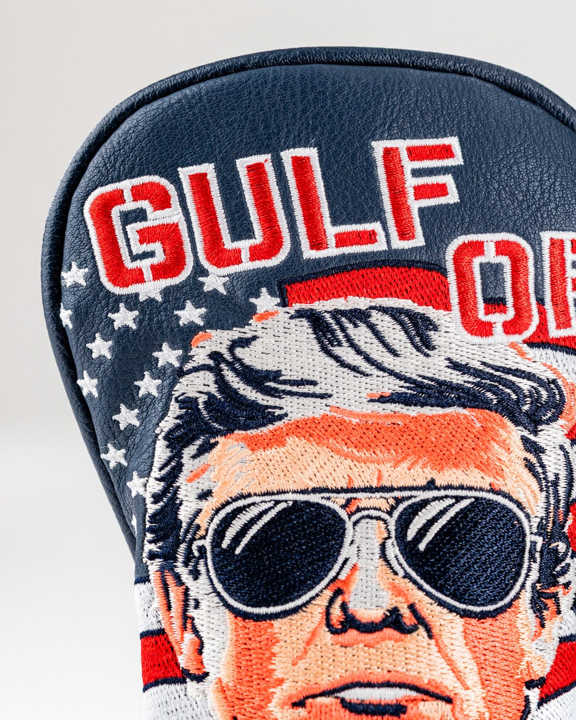 Bold golf hybrid cover featuring a detailed embroidered design of a man with sunglasses and the text "Gulf of America.