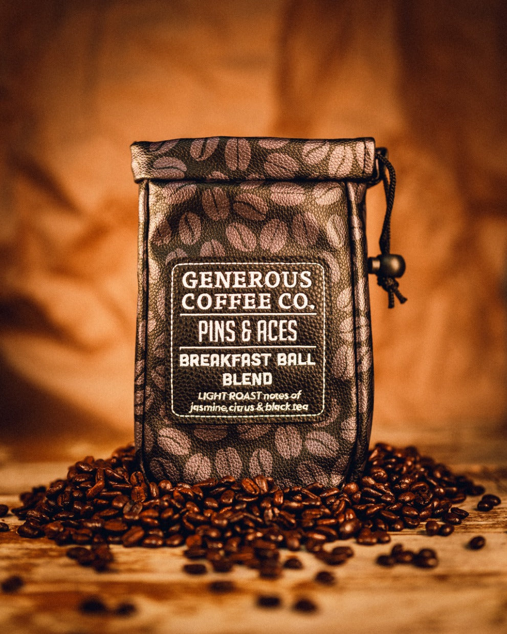 Generous Coffee valuables pouch featuring a stylish design, filled with coffee beans, labeled Breakfast Ball Blend.