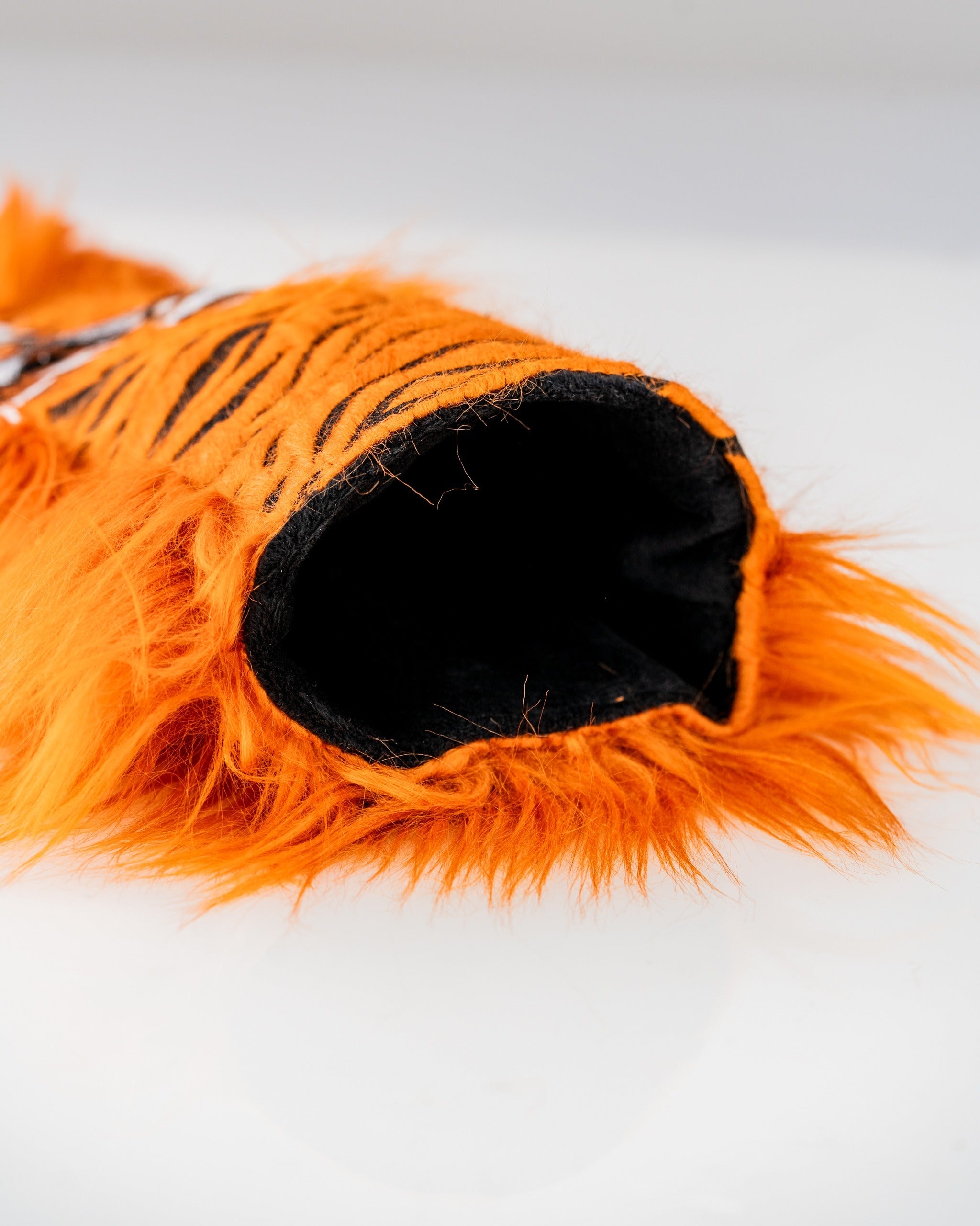 Bold orange tiger driver cover with soft fur and black interior, designed for golfers who want to stand out on the course.