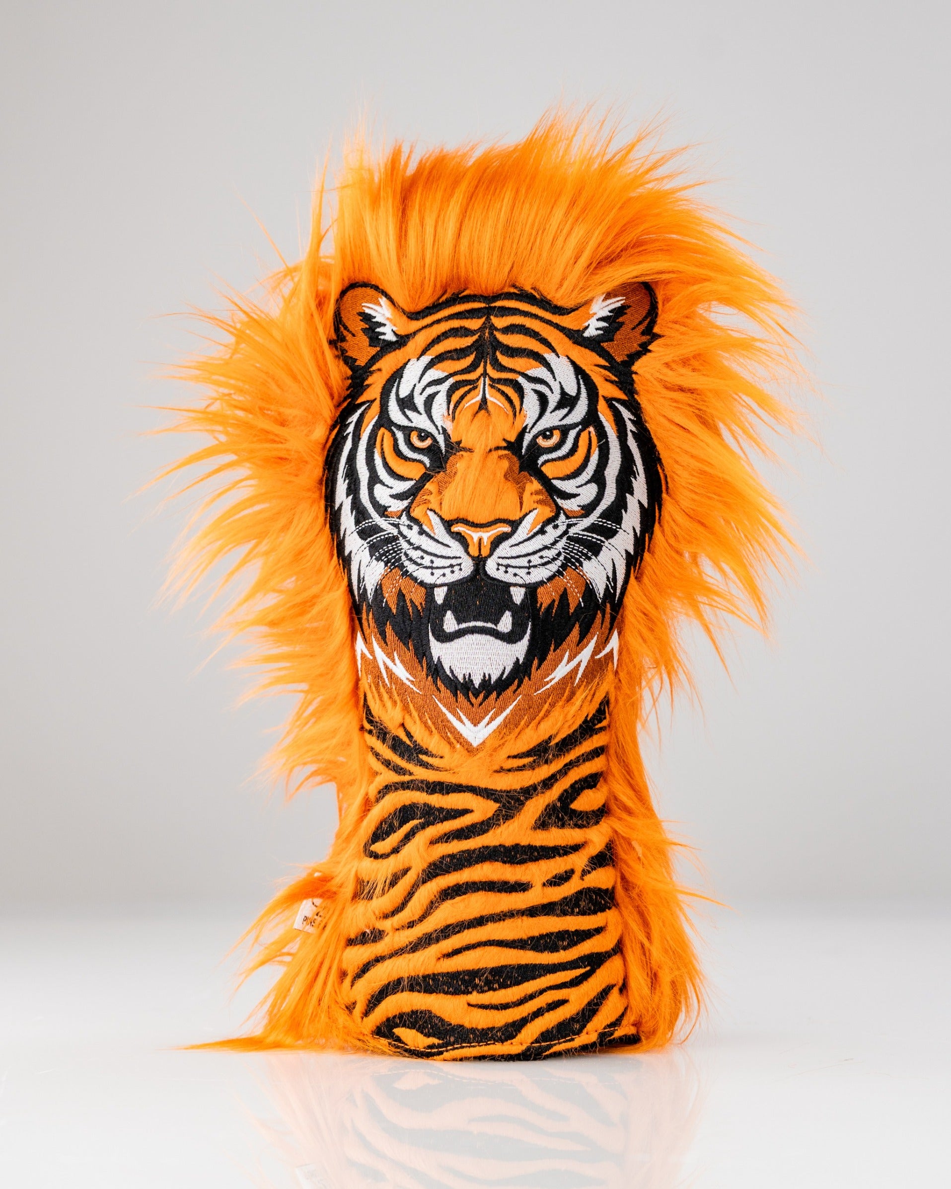 Bold orange tiger driver cover featuring a fierce tiger face and vibrant faux fur mane, perfect for standout golf style.
