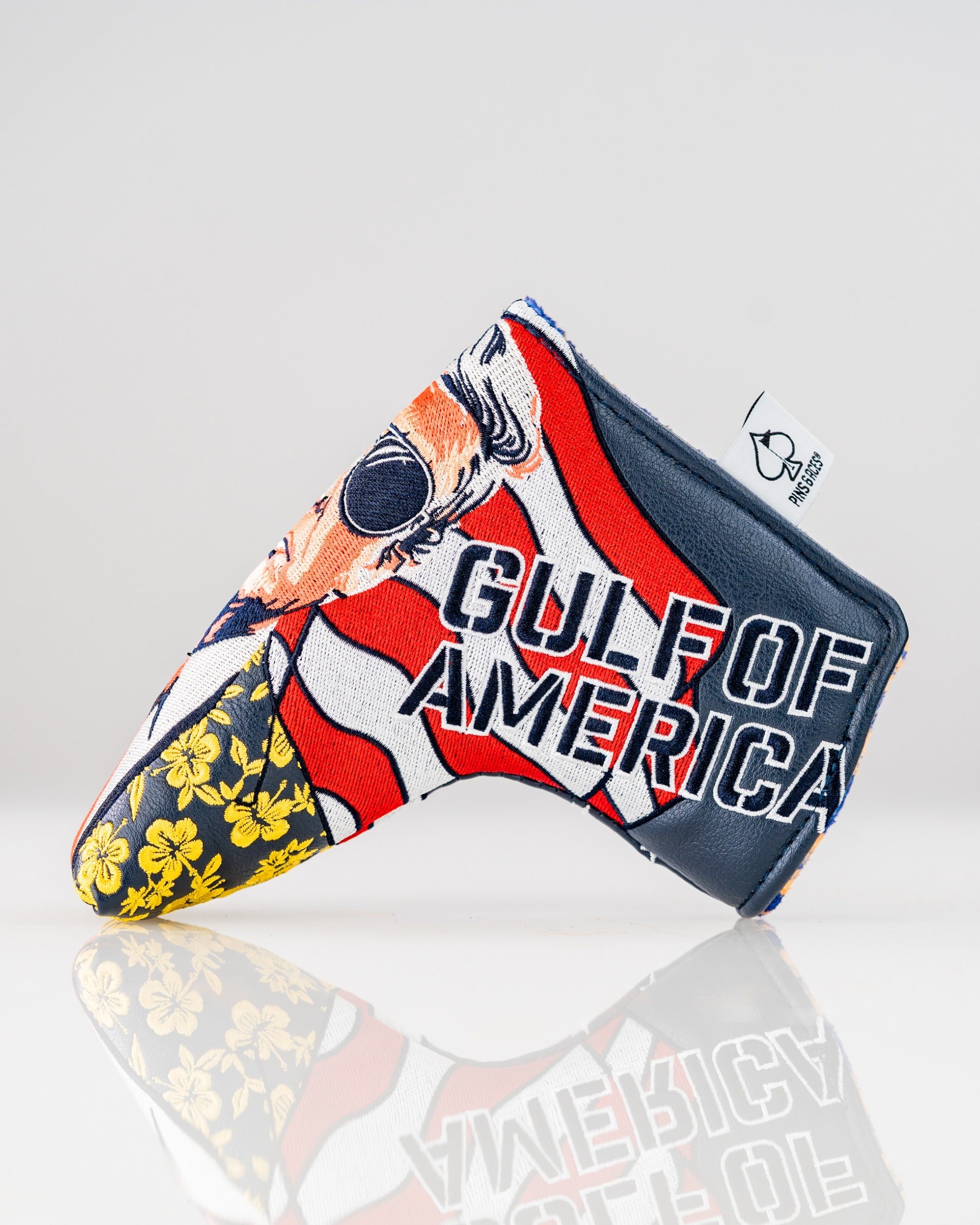 Bold golf blade cover featuring a vibrant design with "Gulf of America" text and patriotic colors, perfect for standout style.