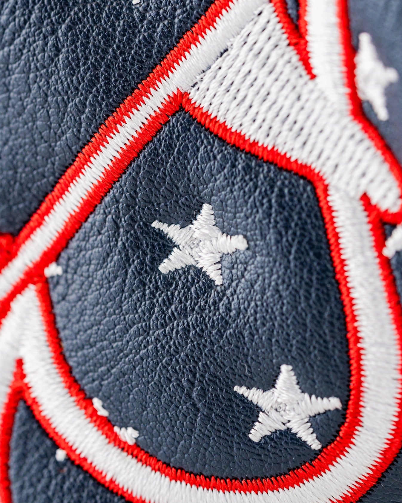 Bold golf blade cover featuring a patriotic design with stars and stripes in red, white, and blue. Perfect for standout style on the course.