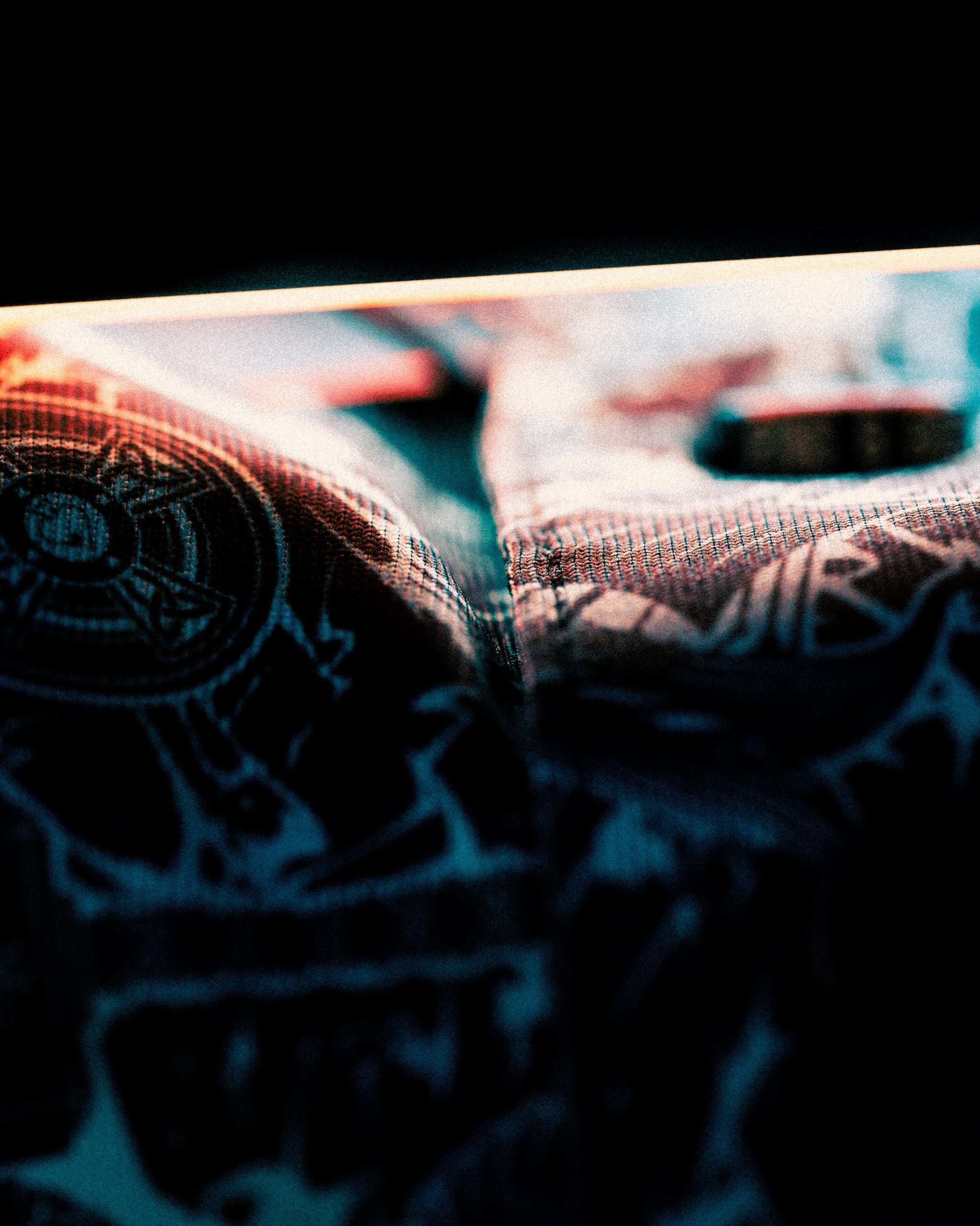 Close-up of a textured fabric from the Black Friday 2025 Mystery Box, showcasing intricate patterns and vibrant colors.