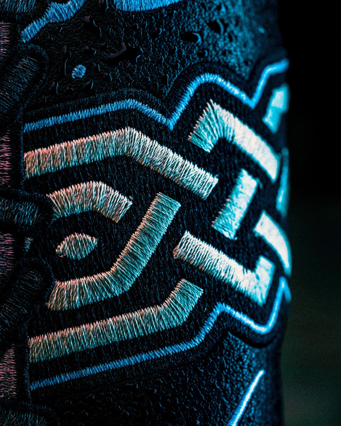 Close-up of intricate embroidery on a golf accessory, showcasing unique design elements for the Black Friday 2025 Mystery Box.