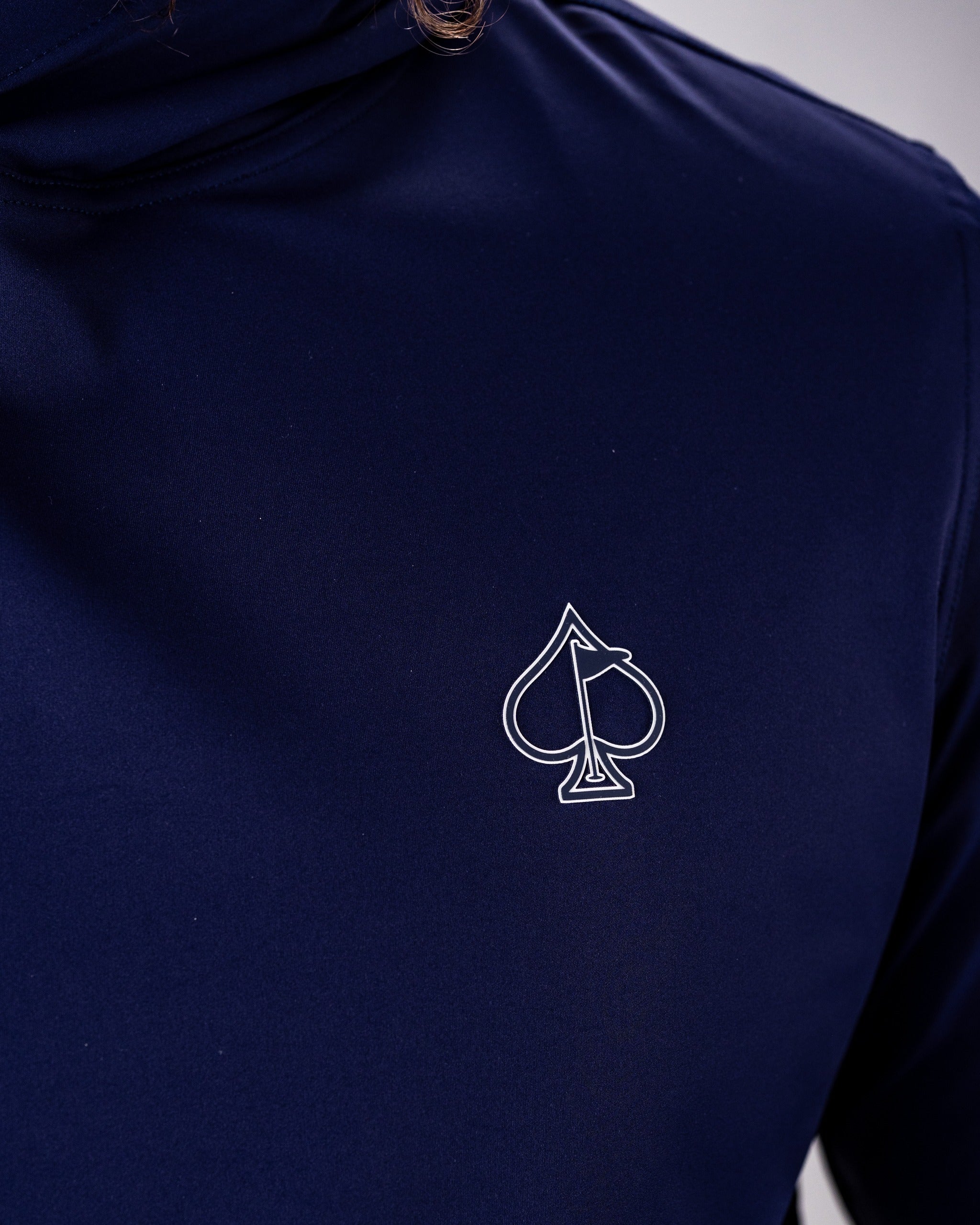 Performance Golf Hoodie in Lavender Flower Power, featuring a sleek design and a spade logo on the chest. Ideal for golfers.