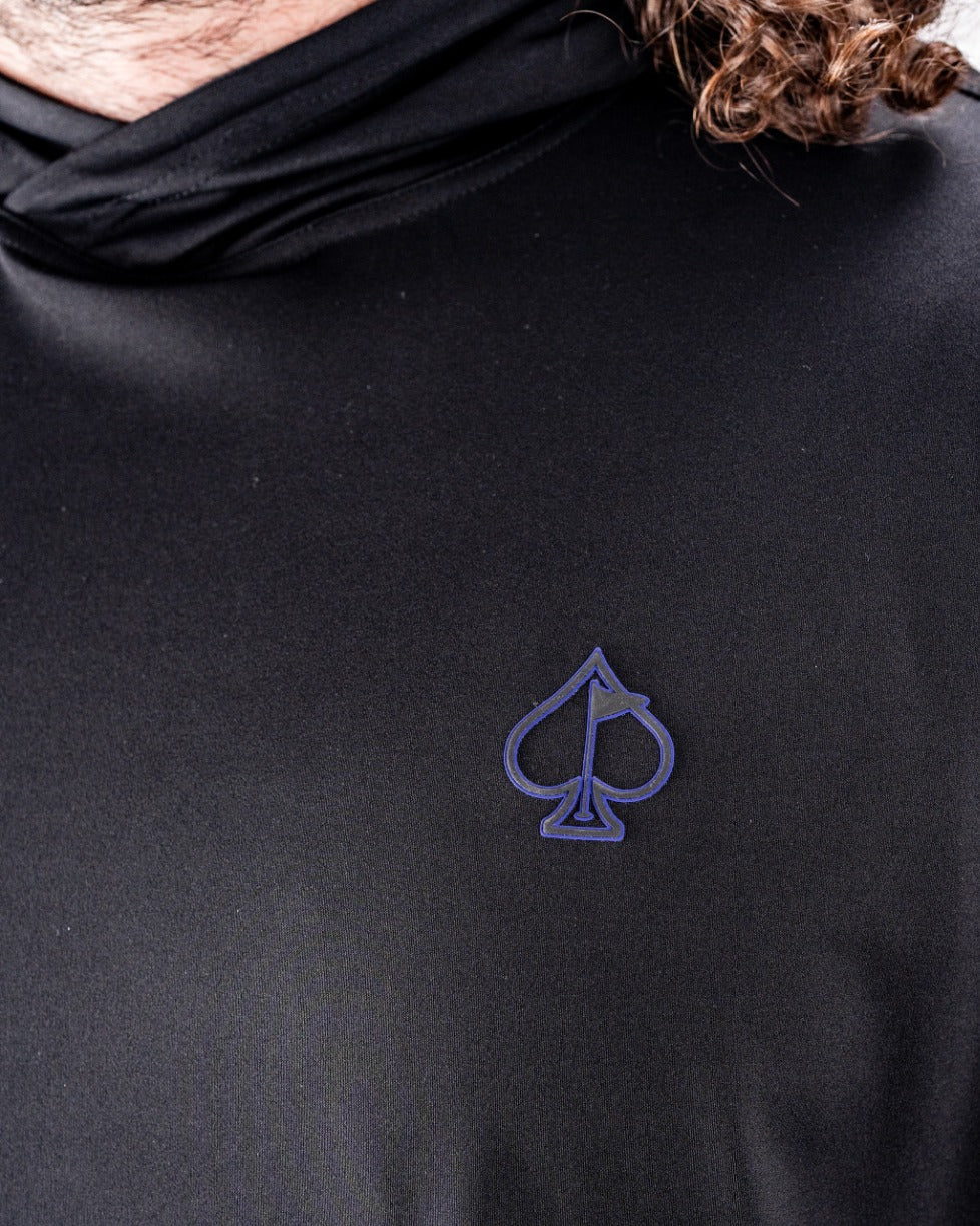 Black performance golf hoodie featuring a subtle poker-themed spade logo on the chest, designed for stylish golfers.